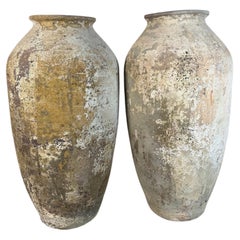 Pair of Monumental Terracotta Olive Jars with Weathered Patina