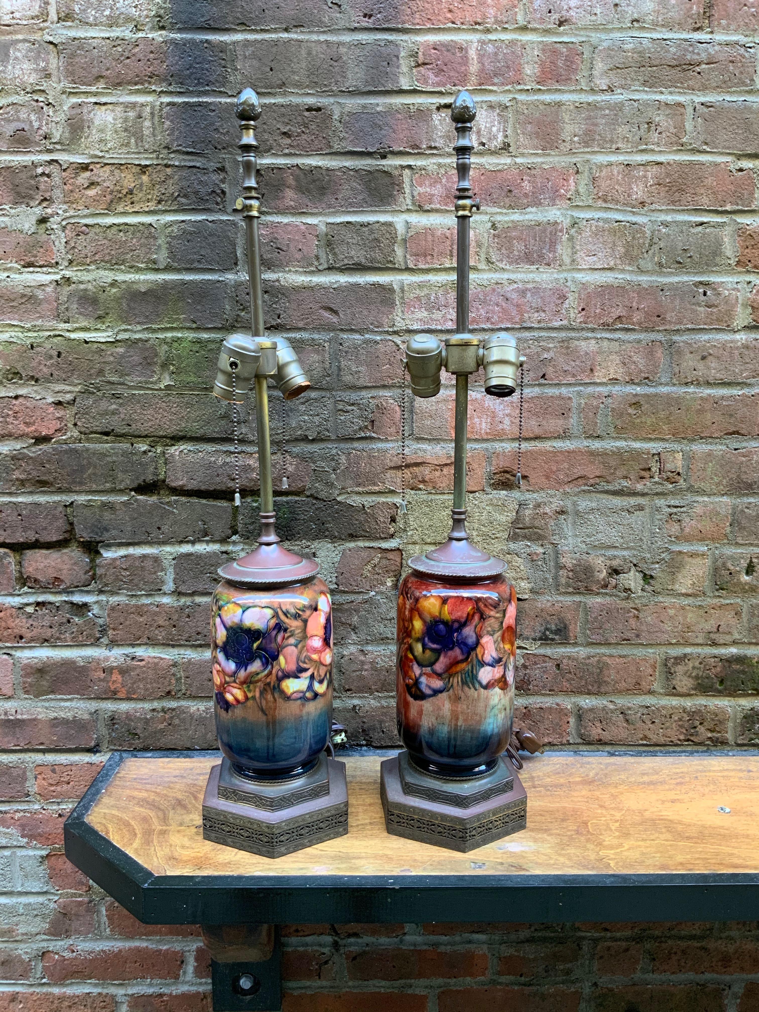 Pair of Moorcroft English art pottery floral lamps. Excellent pair of Moorcroft pots decorated in a floral 