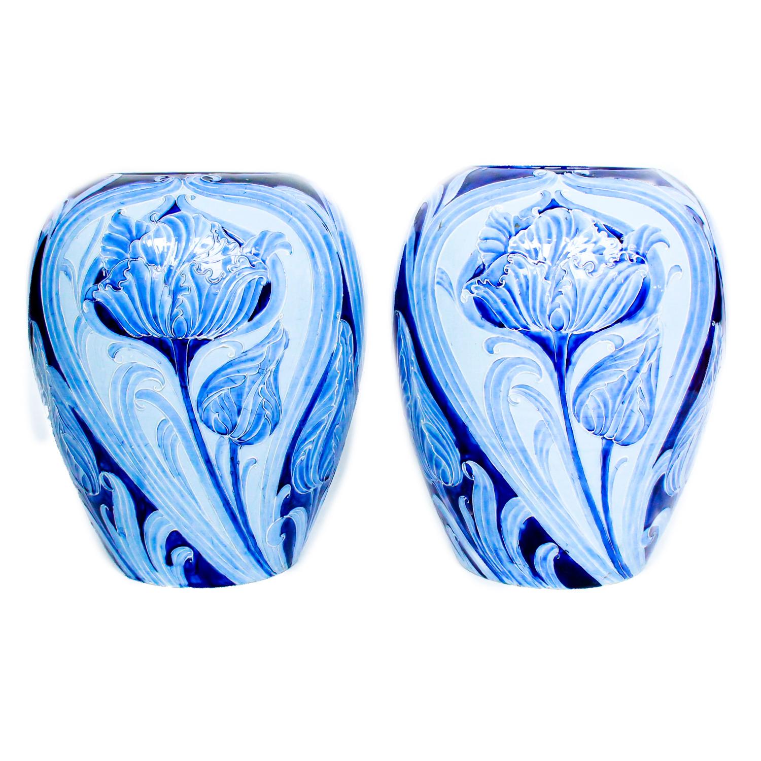 A large pair of early Moorcroft Florian ware Tulip pattern vases, decorated in shades of blue. Painted Florian mark to base.

Literature: A similar pair of vases illustrated in Moorcroft (1897-1993) New Edition, by Paul Atterbury. p.149. pl.1

