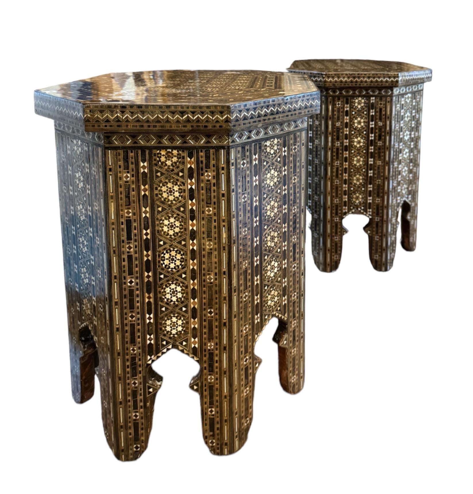 A stunning pair of Moorish inlaid marquetry tables, crafted with meticulous artistry and historical charm. Their octagonal shape is adorned with exquisite mosaic inlays, featuring a mesmerizing array of geometric patterns and shapes meticulously