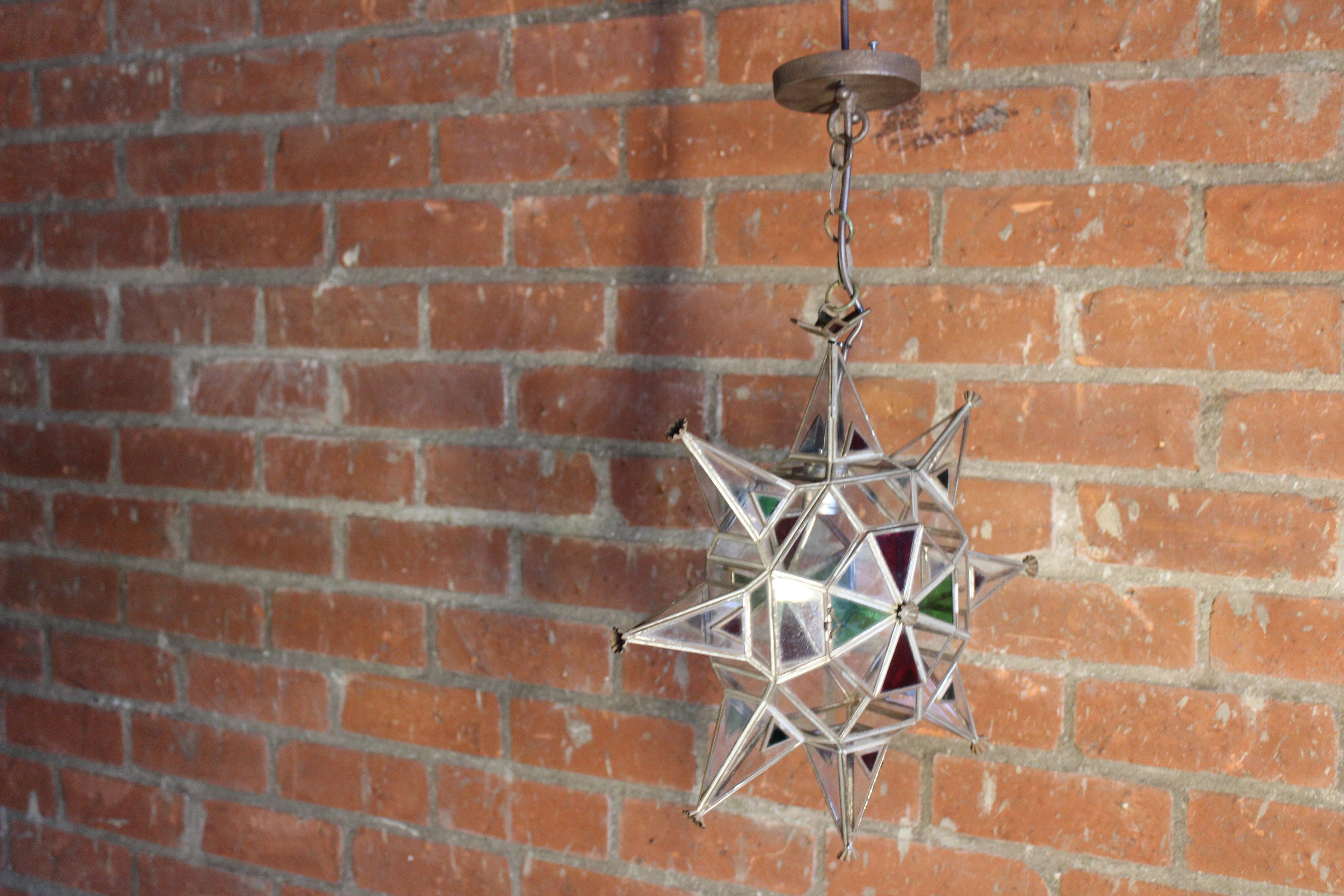 Pair of vintage Moorish style leaded glass star pendant lights. Newly rewired, each pendant uses one standard light bulb. Sold as a pair.
They hang 26