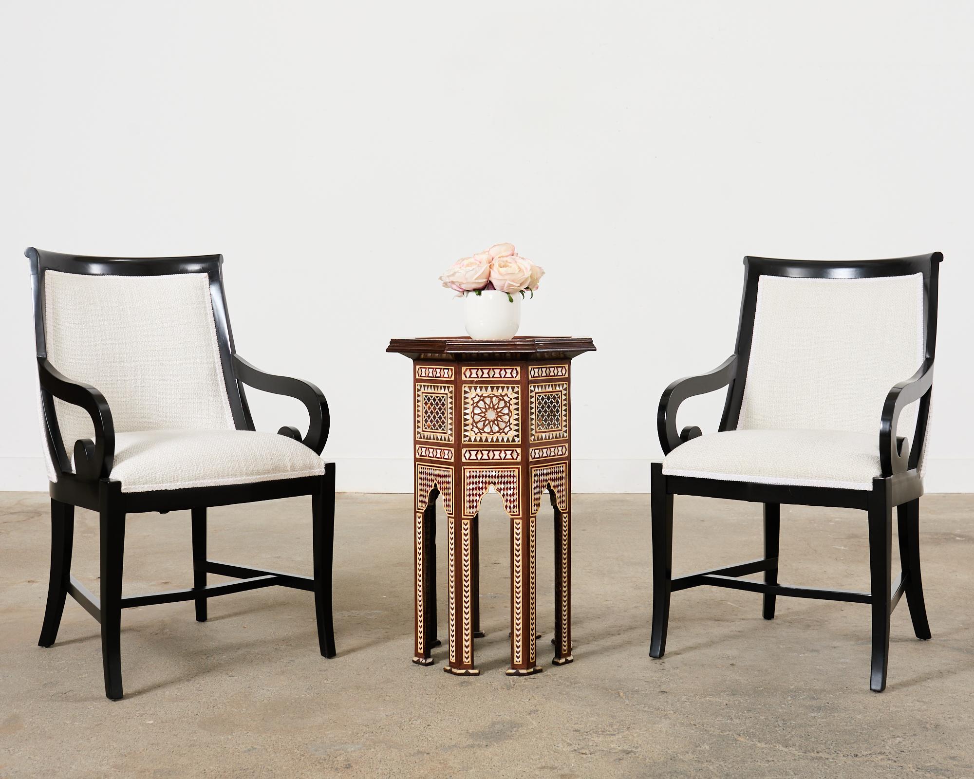 Amazing pair of large pedestal drinks tables made in the Moorish Middle Eastern or Moroccan style with intricate mosaic inlay. The pedestals measure 28.5 inches high with an octagonal form. The tops have a subtle galleried border decorated with