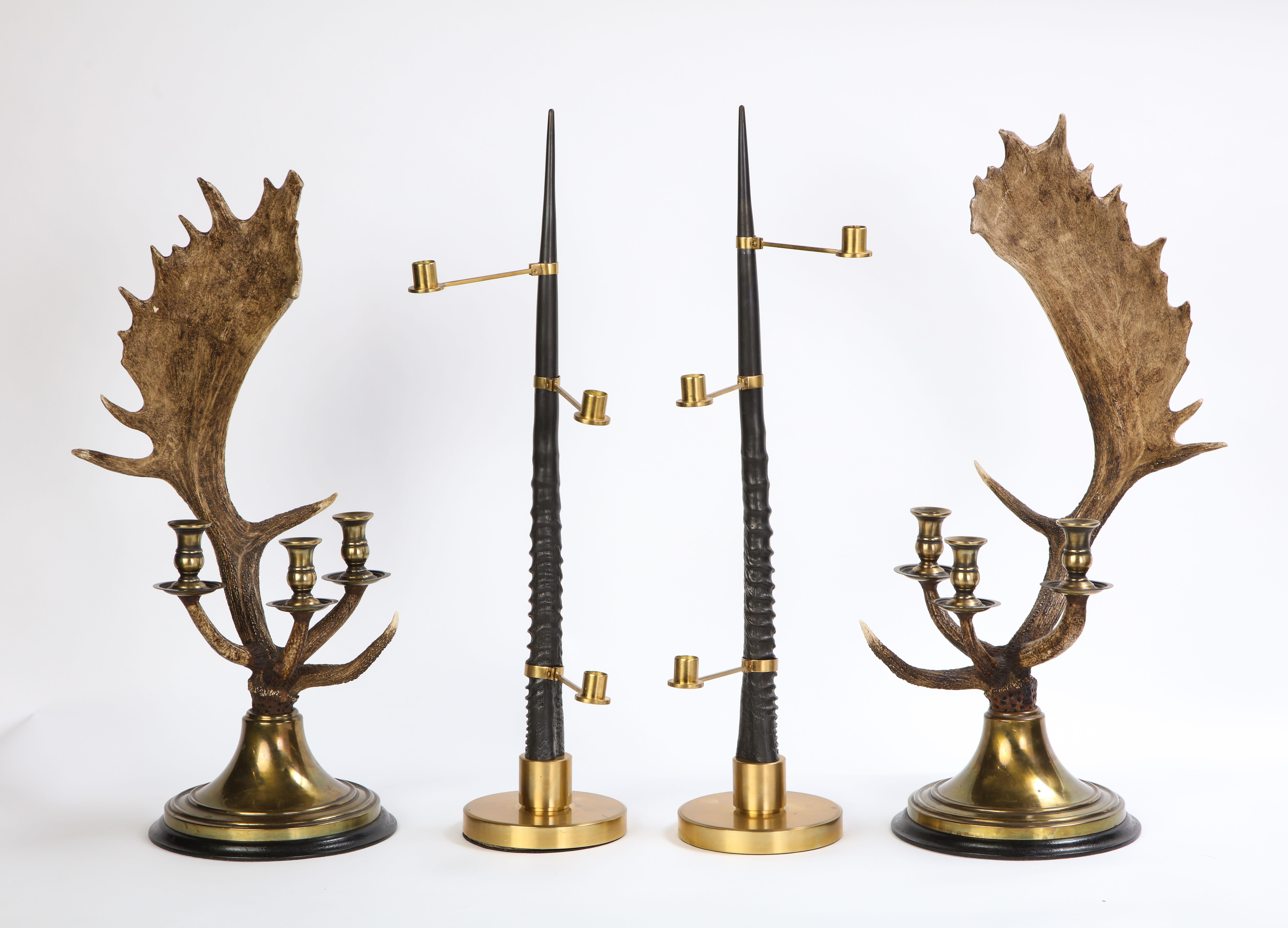 This set of five candelabra includes a striking pair of modern brass-mounted moose antler-form three-light candelabra, as well as an antler-form table mount and a pair of modern gilt-metal mounted faux antler three-light candelabra. This set is