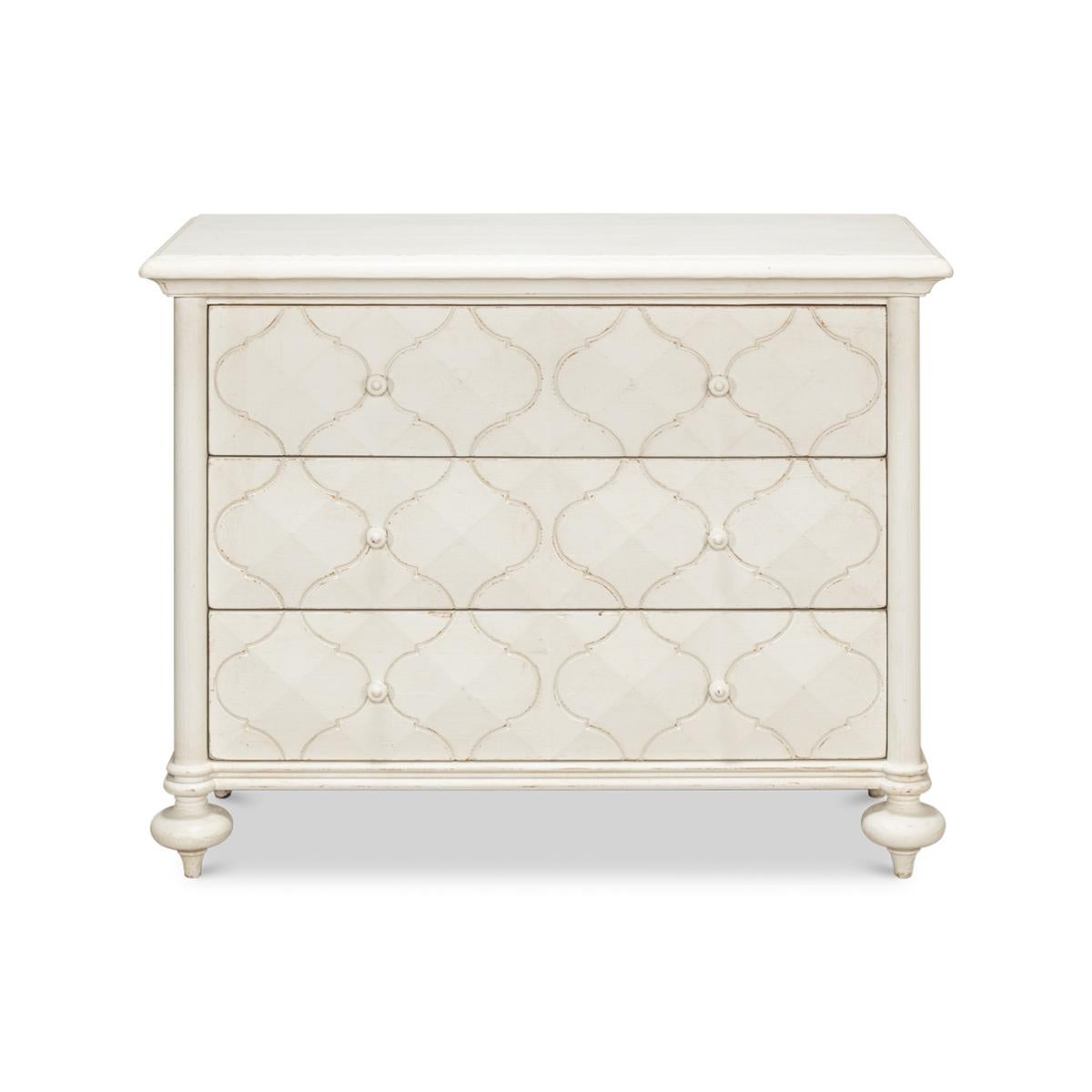 Pine wood painted three-drawer dresser in an antique white painted finish. With a rectangular molded edge raised on turned taupee feet.

Dimensions: 44