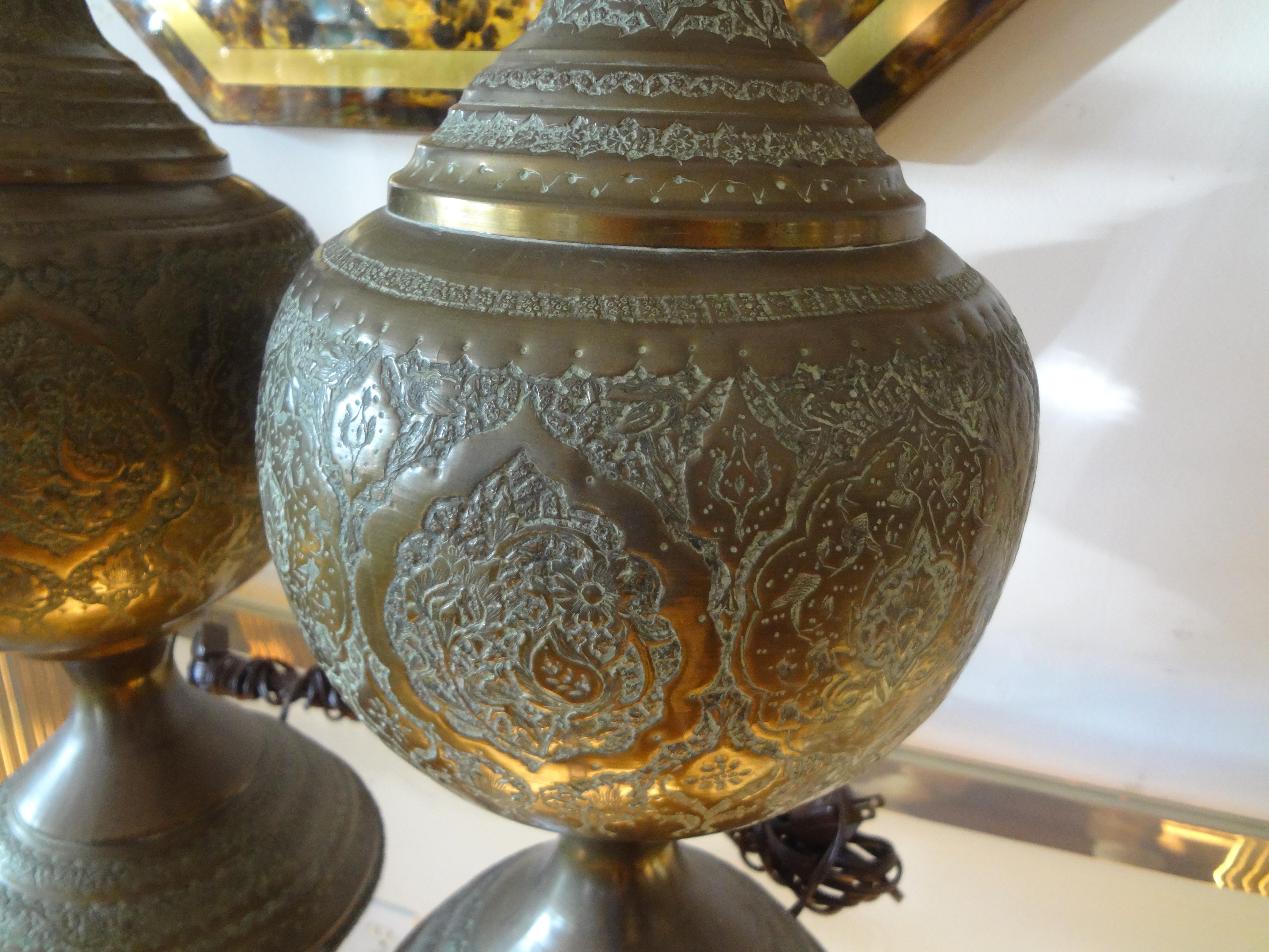 Pair of Moroccan Arabesque Style Incised Brass Lamps.
Stunning tall pair of Moroccan, Anglo-Indian or Moorish style incised brass table lamps. These fantastic grand scale Arabesque style lamps are 48.5