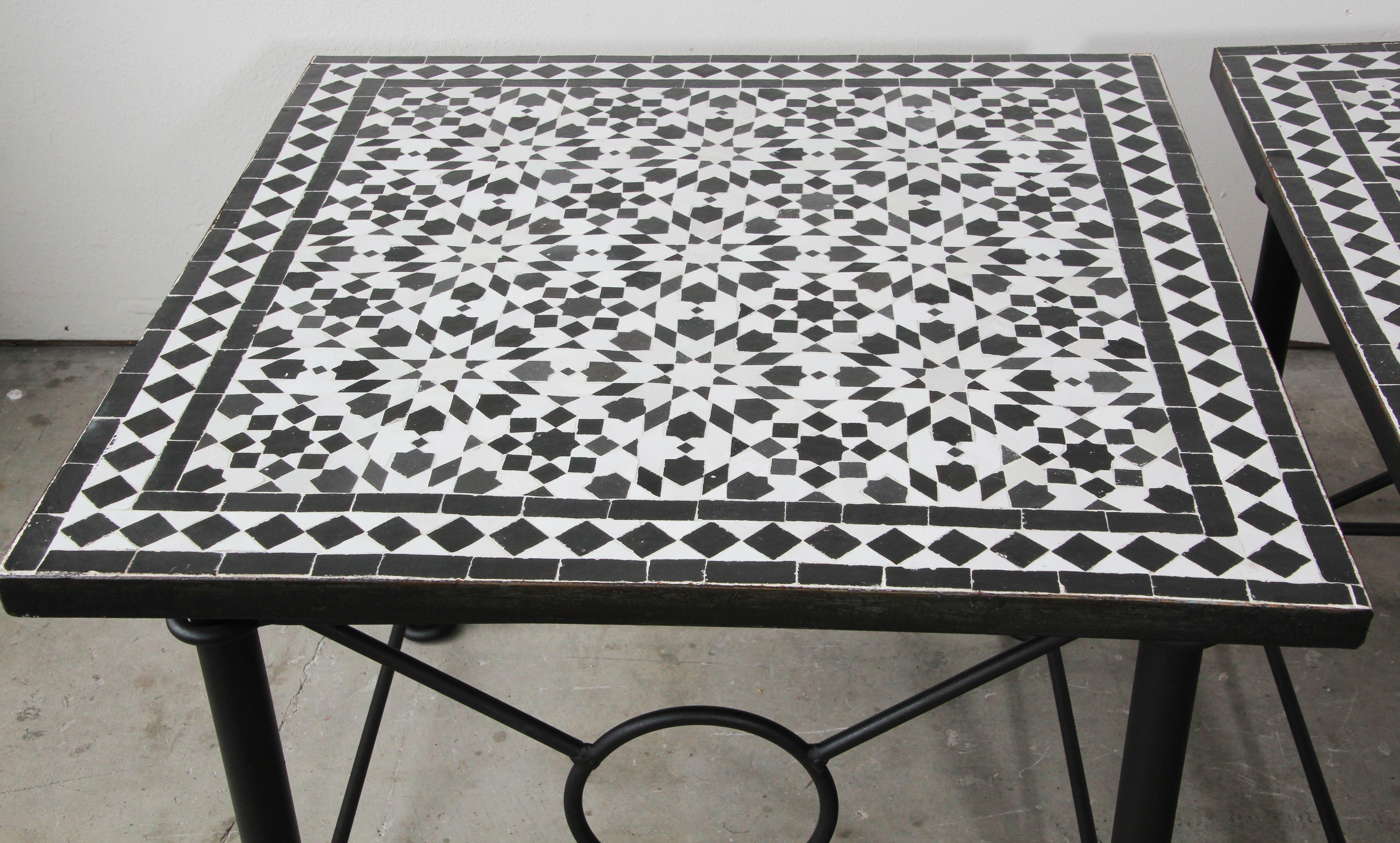 Moroccan mosaic Fez tiles side table on iron base.
Handmade by expert artisans in Fez, Morocco using reclaimed old glazed black and white colors tiles inlaid in concrete and making beautiful geometrical Moorish Fez designs, colors are black and