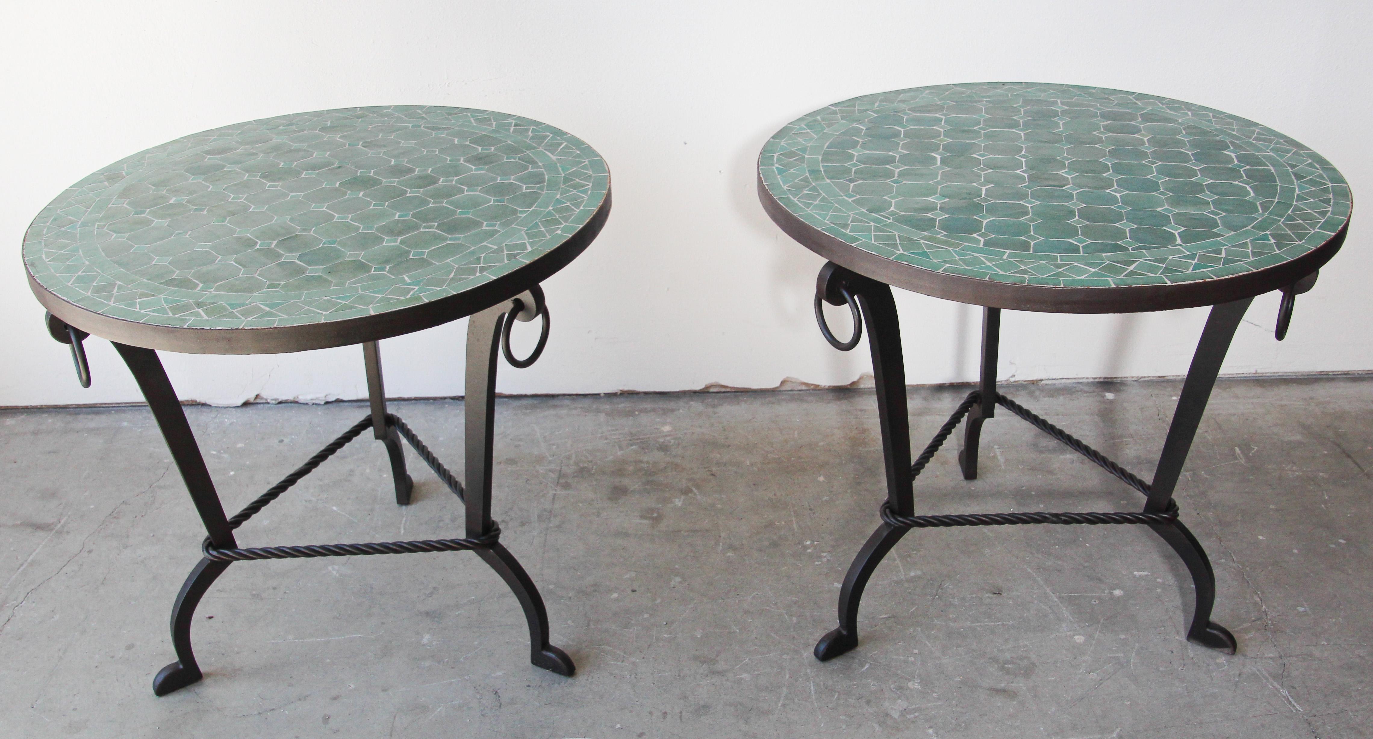 Pair of Moroccan mosaic Fez emerald green tiles table on iron base.
Handmade by expert artisans in Fez, Morocco using reclaimed old glazed emerald green colors tiles inlaid in concrete and making beautiful geometrical Moorish Fez designs, the iron