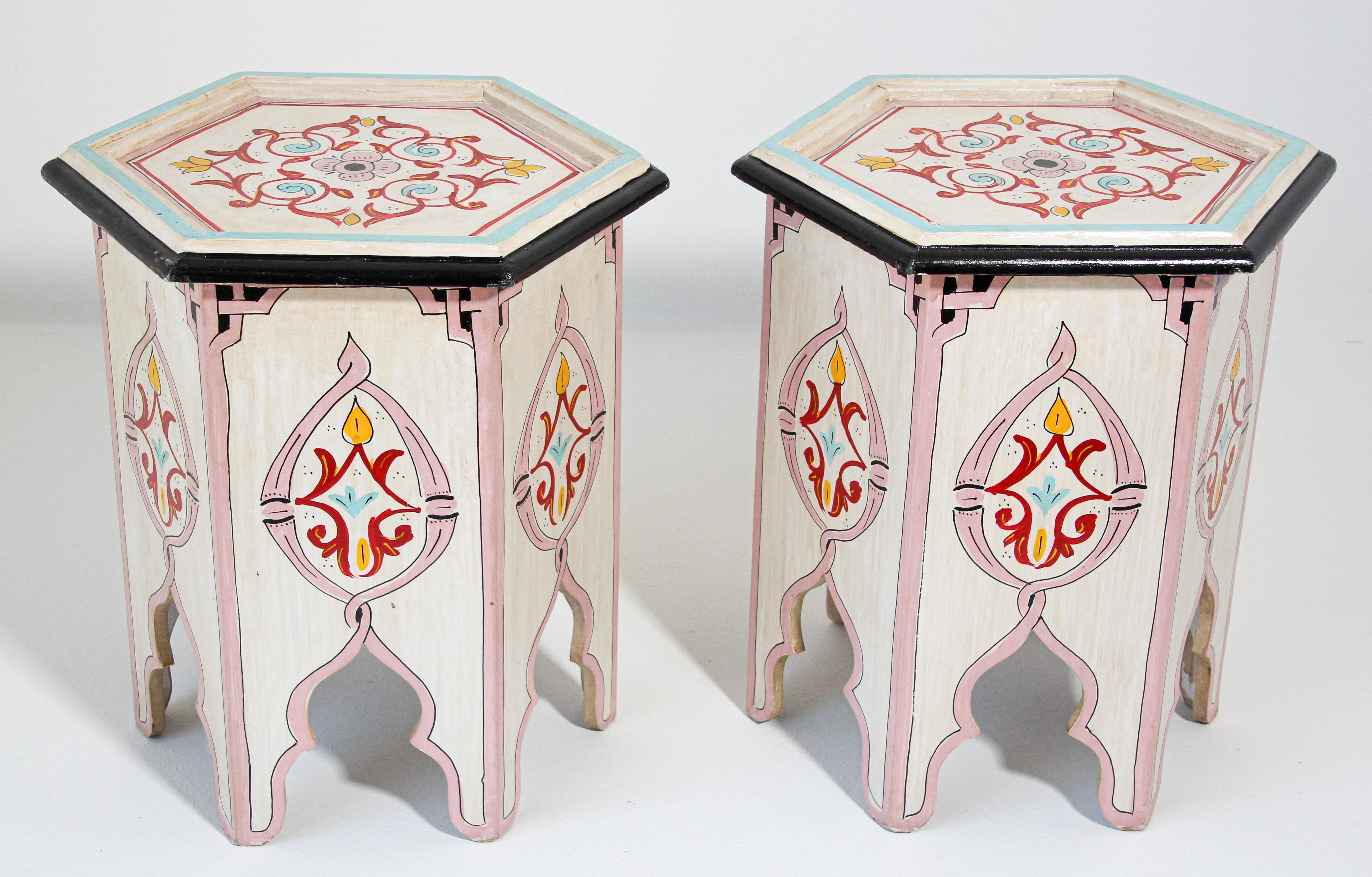 Pair of Moroccan colorful hand painted ivory occasional table with Moorish designs.
Ivory white background with multicolored saffron floral and geometric designs.
Very decorative fine artwork in octagonal shape base.
This exotic small side tables