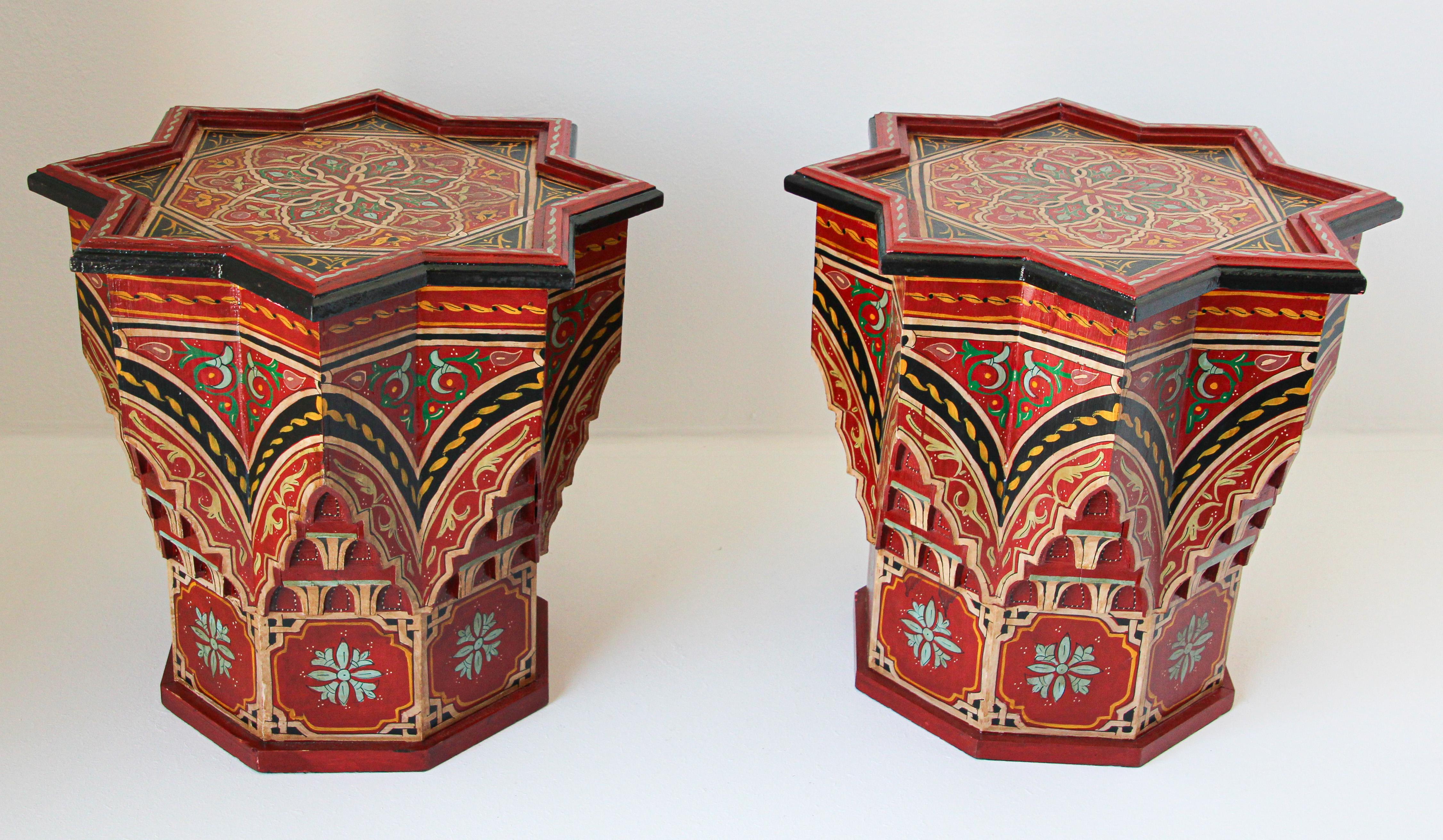Pair of Moroccan colorful red hand painted and carved side occasional table with Moorish Islamic designs.
Vintage Moroccan Pedestal tables in red background with multicolored floral and geometric designs.
Very decorative Moroccan tables with fine