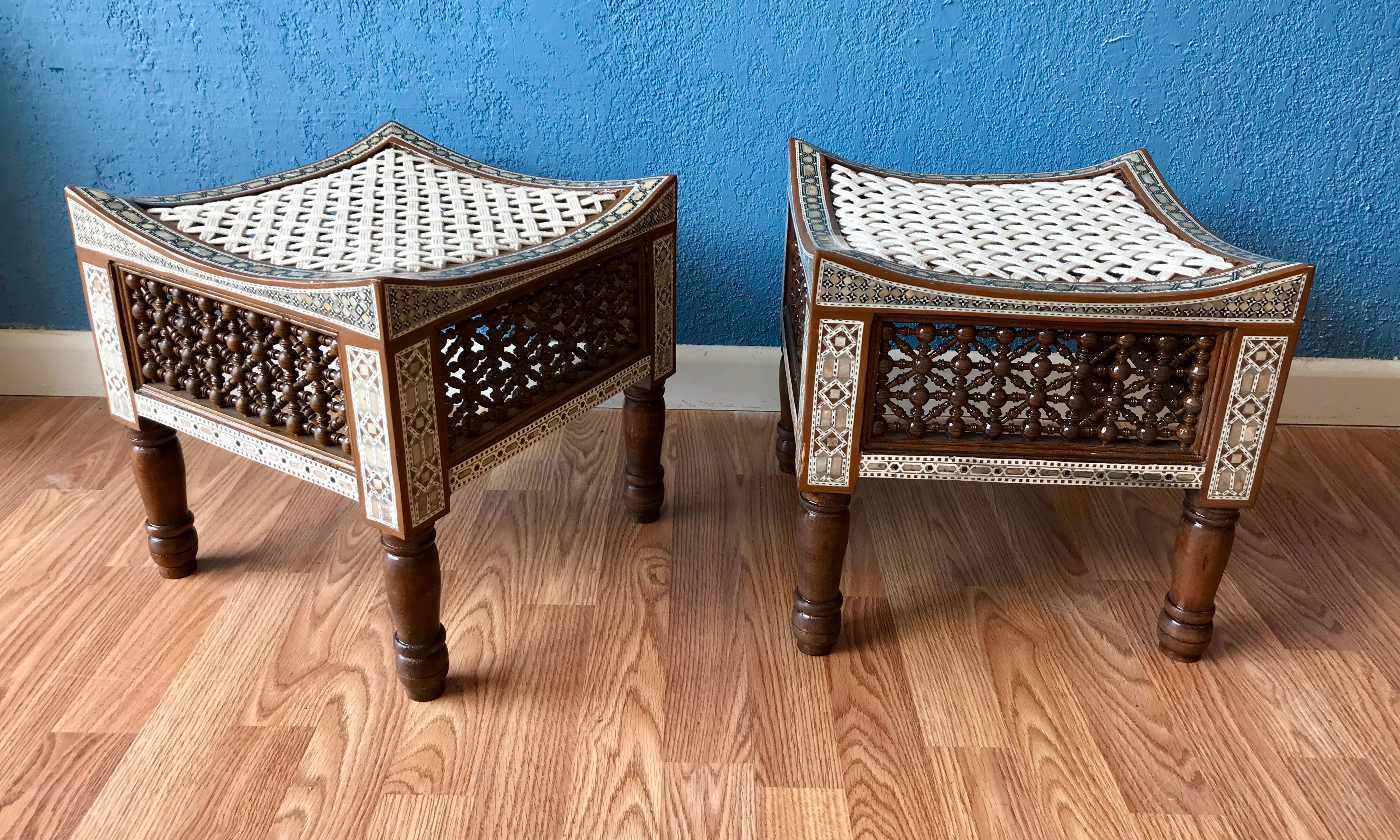 A highly stylized pair with elaborate inlays of mother-of-pearl and camel bone.
The side panels intricately carved. A Thebes like form. The tops are tied with intertwined 