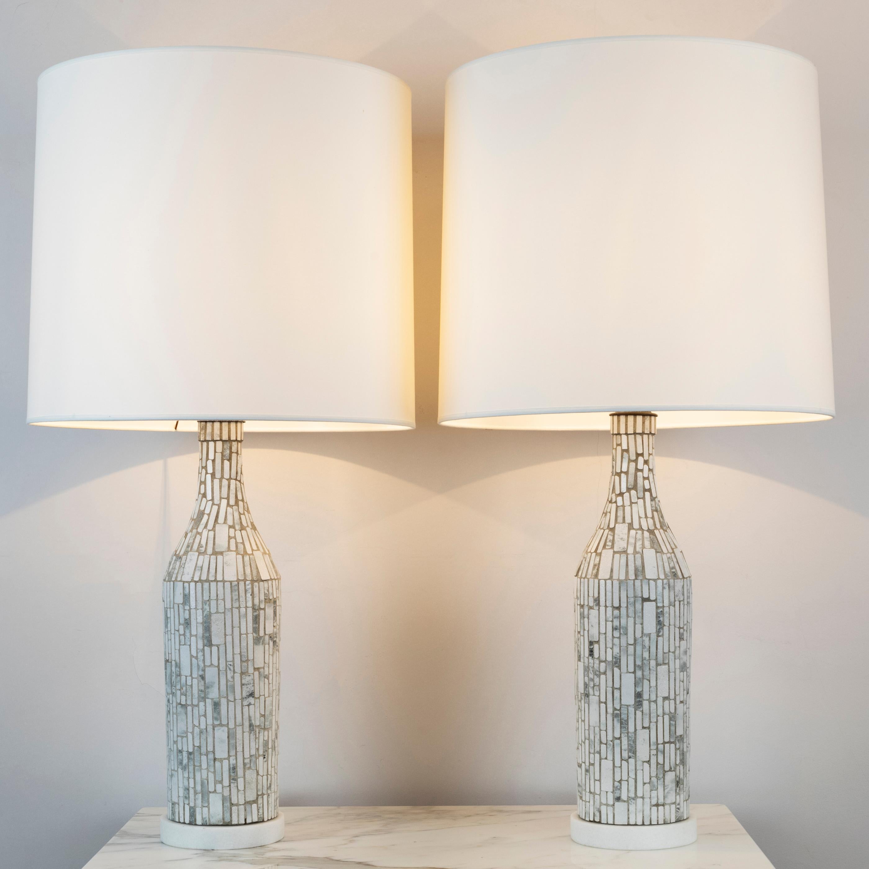 Pair of “Mosaic” table lamps
The body is made in ceramic mosaic, on a marble base.
France, circa 1950.

Measures: Height 37 in. (94 cm) 
Diameter 18.1 in. (46 cm)

Height base 20.5 in. (52 cm) 
Diameter base 5.9 in. (15 cm).