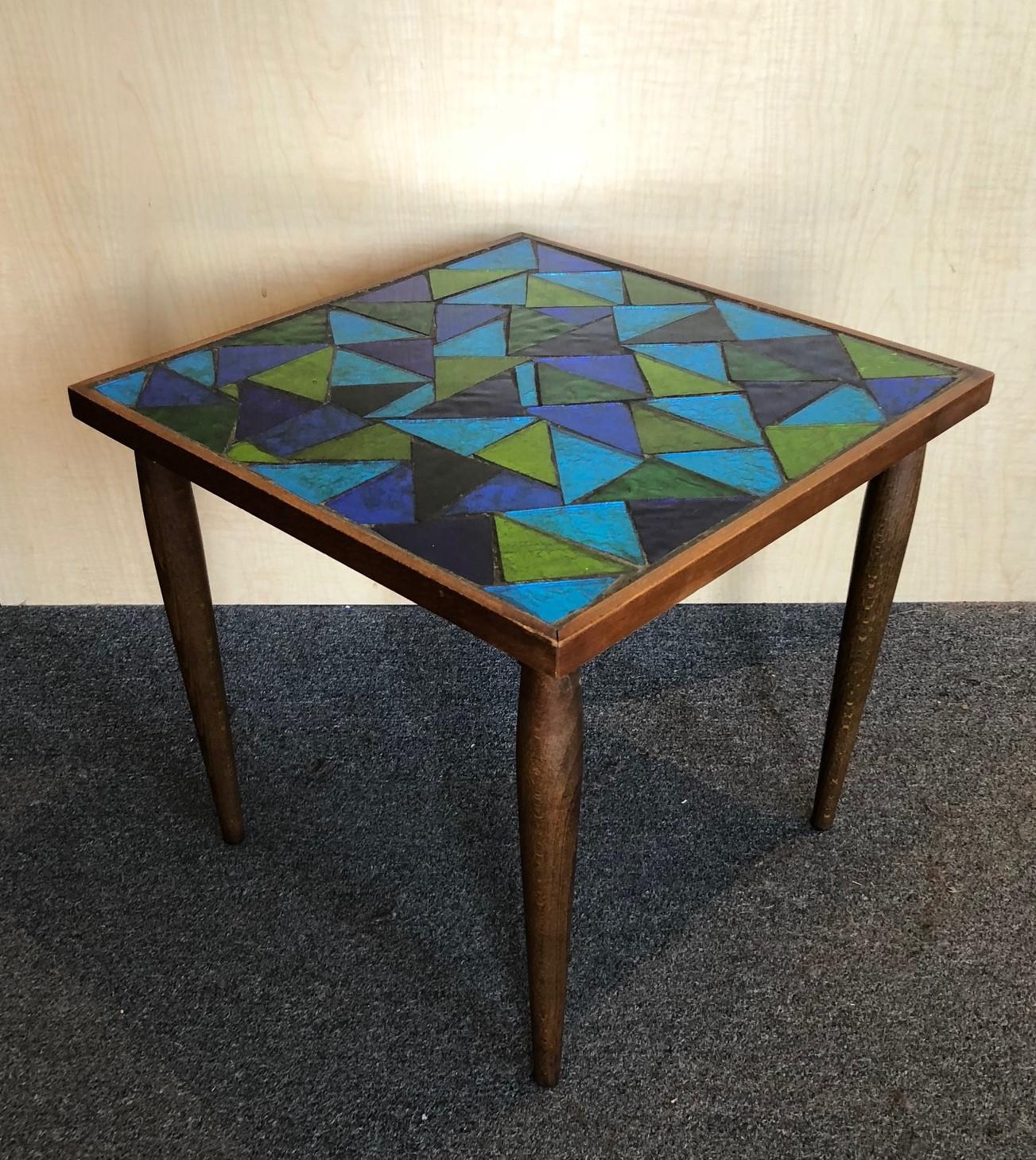 Pair of green and blue glass mosaic top side tables by Georges Briard, circa 1960s. The tables are 16