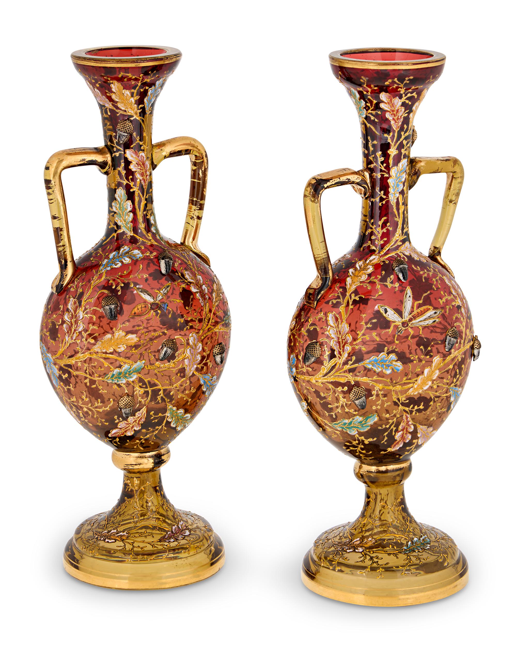 Pair of Glass and Enamel Acorn Vases
Moser
Late 19th Century

This exquisite pair of miniature two-handled vases exemplifies the remarkable artistry of Moser, one of the most celebrated names in Bohemian glassmaking. Despite their small scale, these