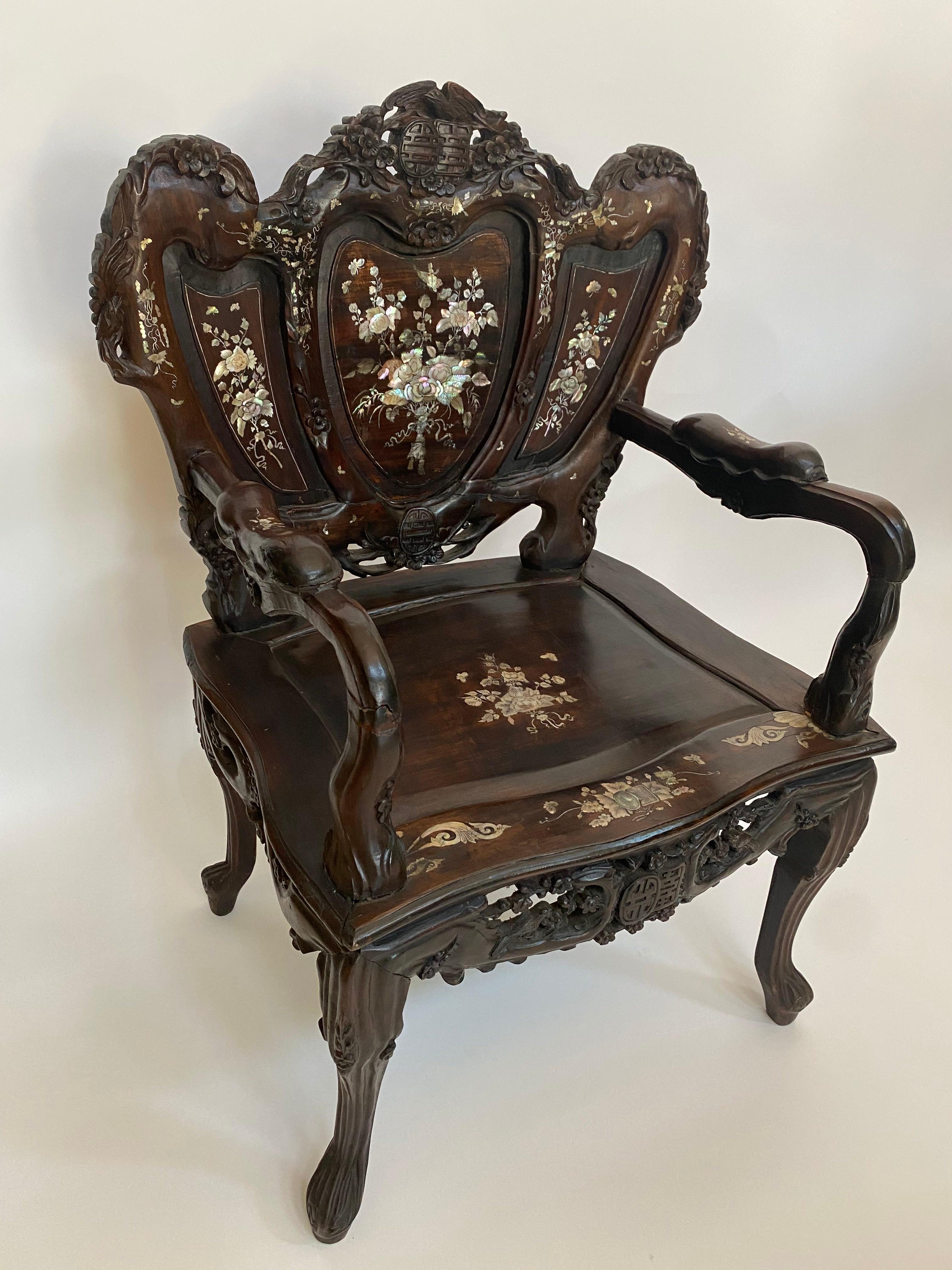 20th century pair of mother of pearl inlay Chinese armchairs. Decorated all over with intricate beautiful floral designs, some designs are carved and some are painted.