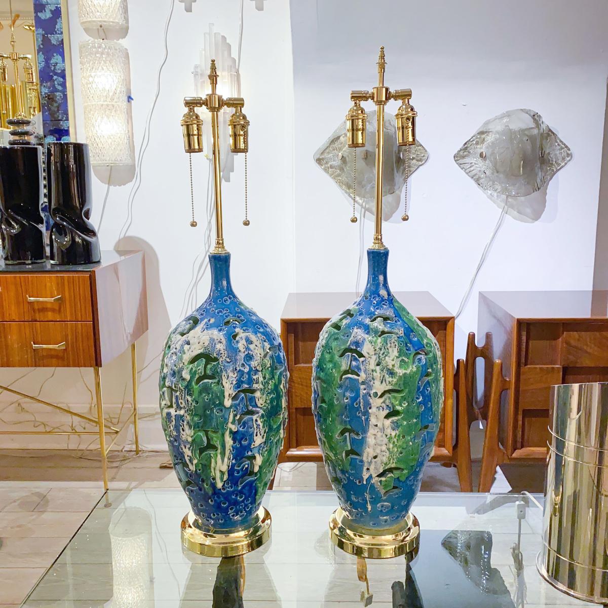 Pair of mottled blue, green and white ceramic table lamps with openwork design.