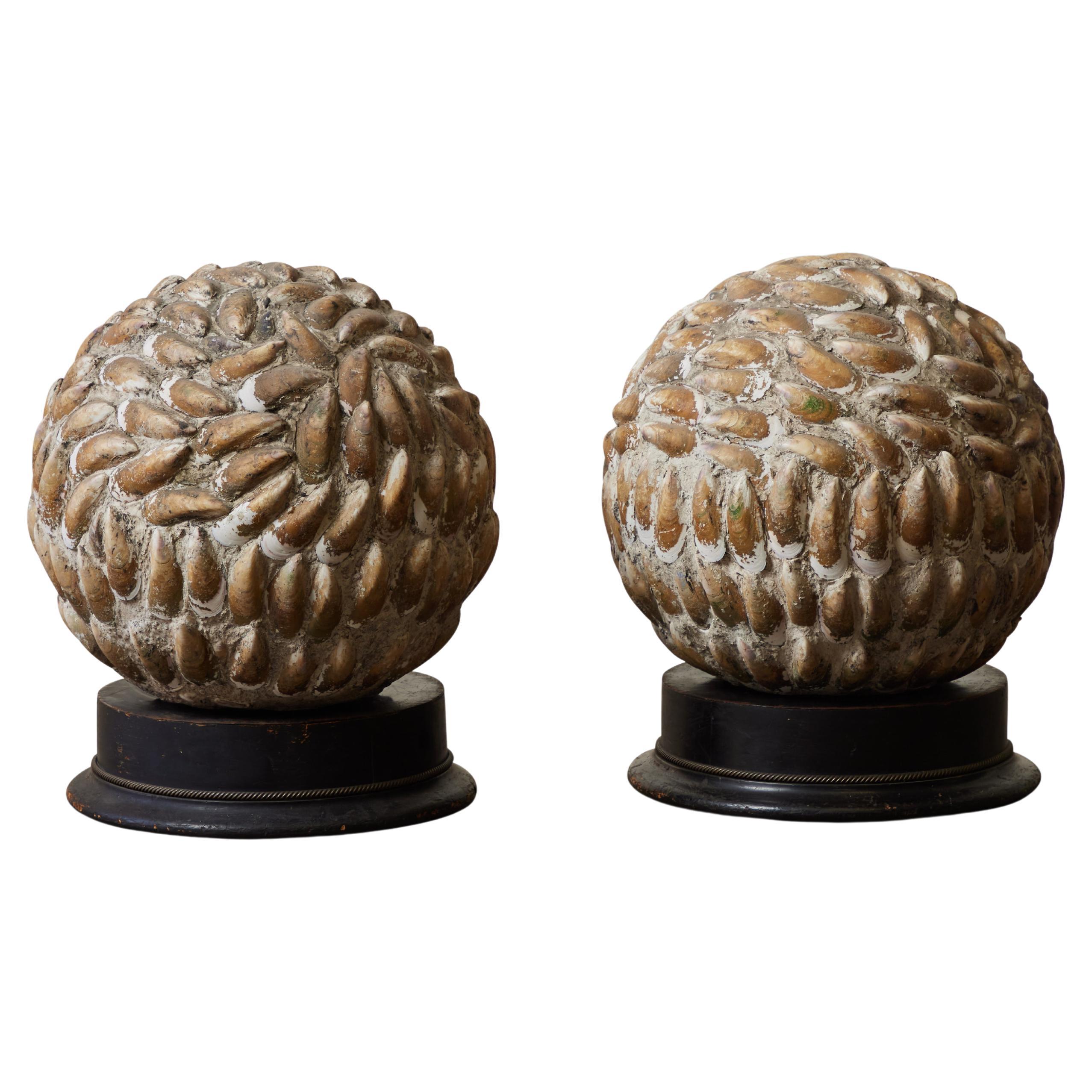 Pair of Mounted Spherical Shell Sculptures