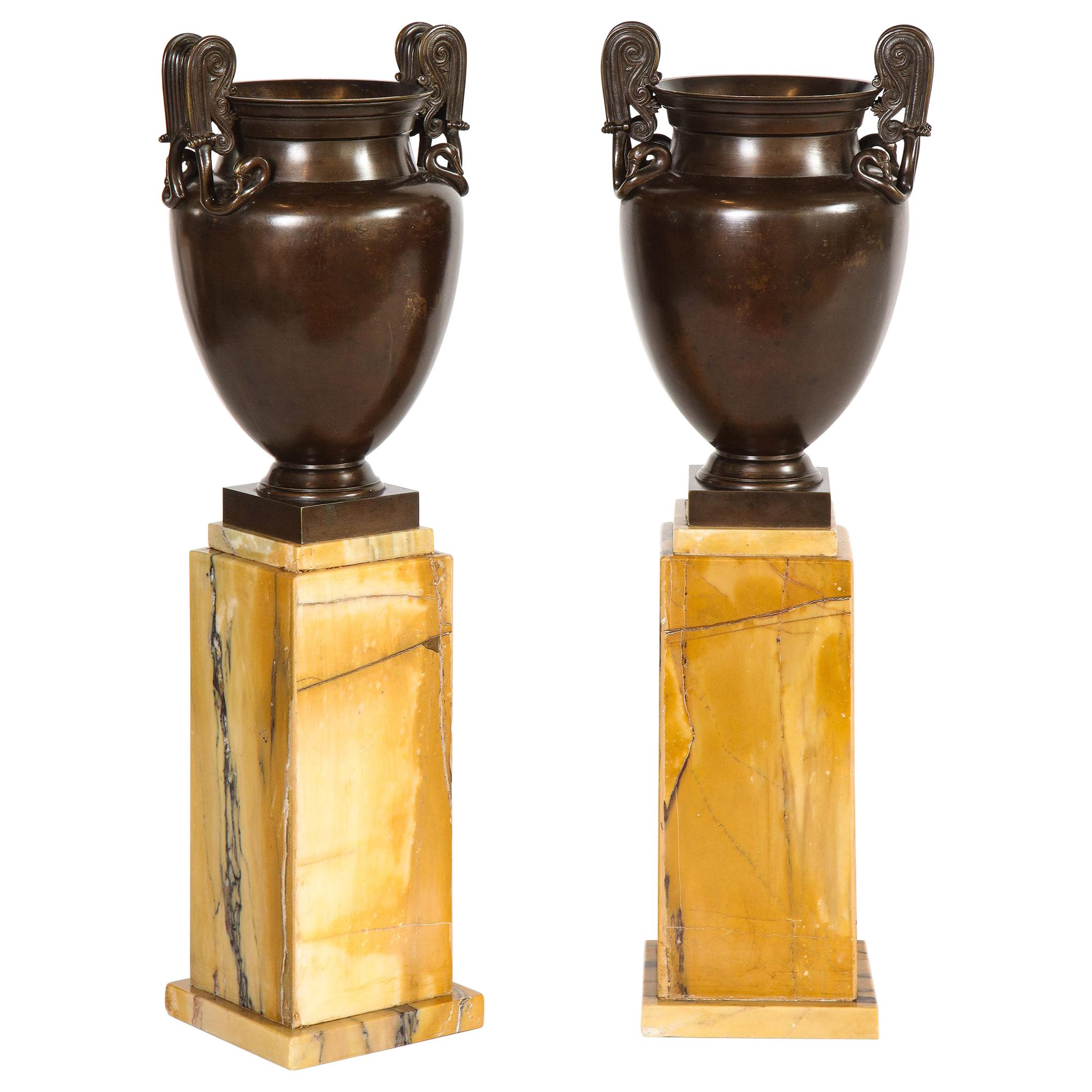 Pair of Mounted Urns For Sale