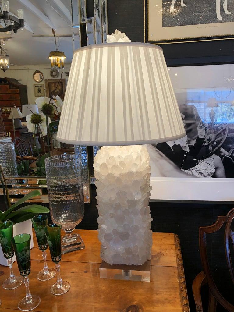 Sensational big gutsy glamorous custom made table lamps having sculptural rock crystal column that reminds us of mouthwatering rock candy, having lucite base, custom pleated shade and scrumptious matching rock crystal finial. 
Base is 7