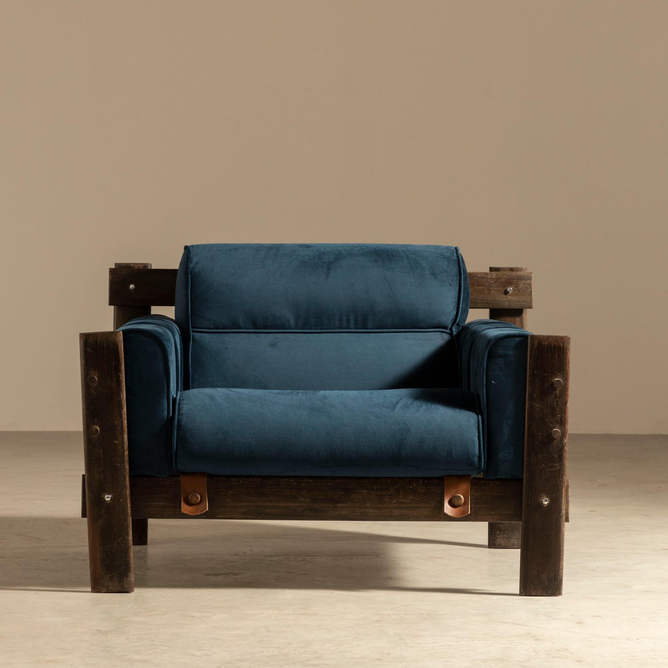 The MP-51 armchair is a true rarity in the world of furniture design, with its entire structure crafted from Pau Ferro, a highly sought-after Brazilian hardwood that can only be found in the forests of Brazil. The armchair's unique construction