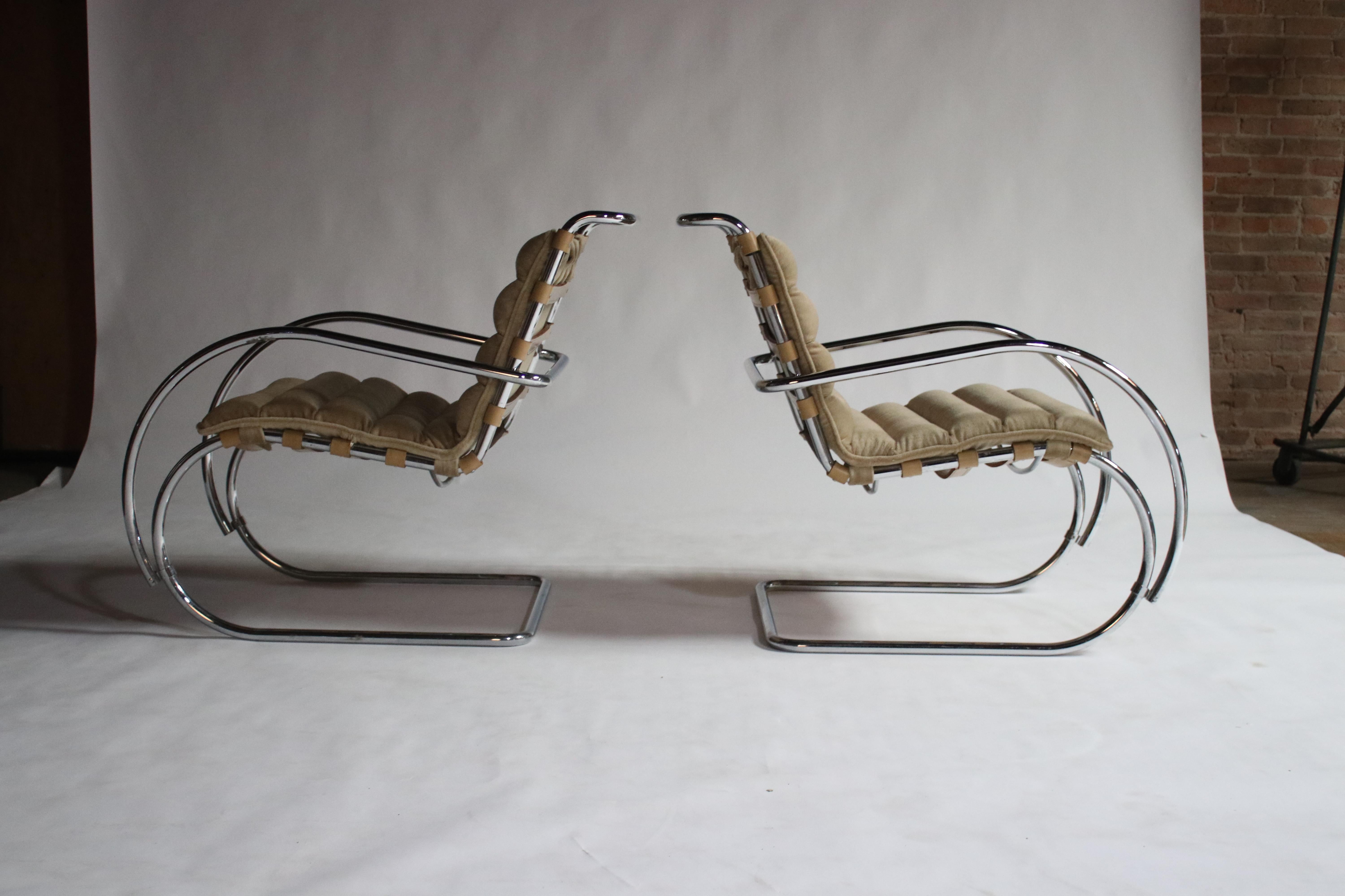 Pair of MR Lounge armchairs by Mies van der Rohe in original camel strap leather and polished chrome with newly upholstered camel color mohair pads.