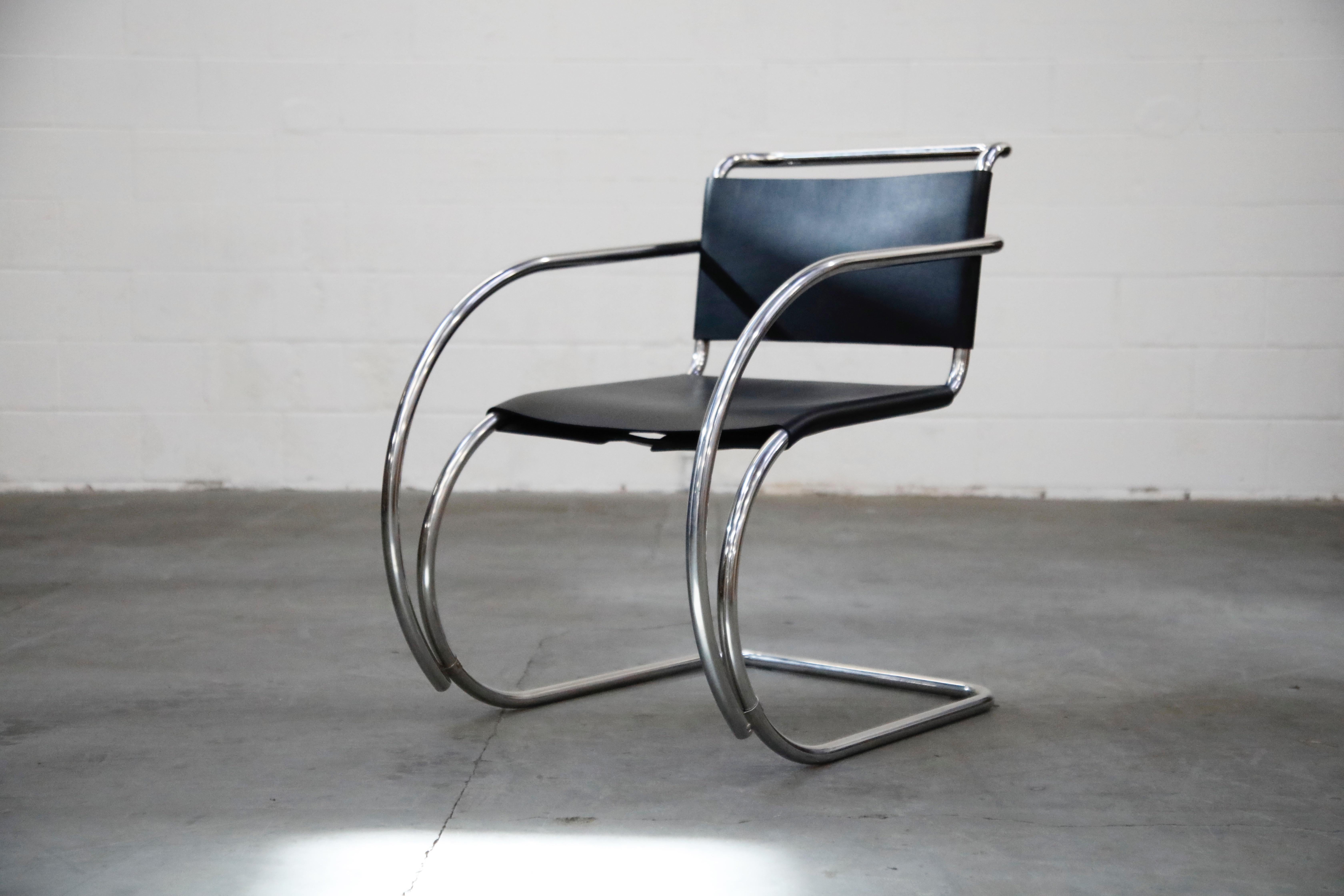 An incredible set of two (2) signed cantilevered MR 20 armchairs by Ludwig Mies van der Rohe for Knoll Studio. In excellent showroom condition, this collectible pair of arm chairs possess their original Knoll Made in Italy labels and the frames are