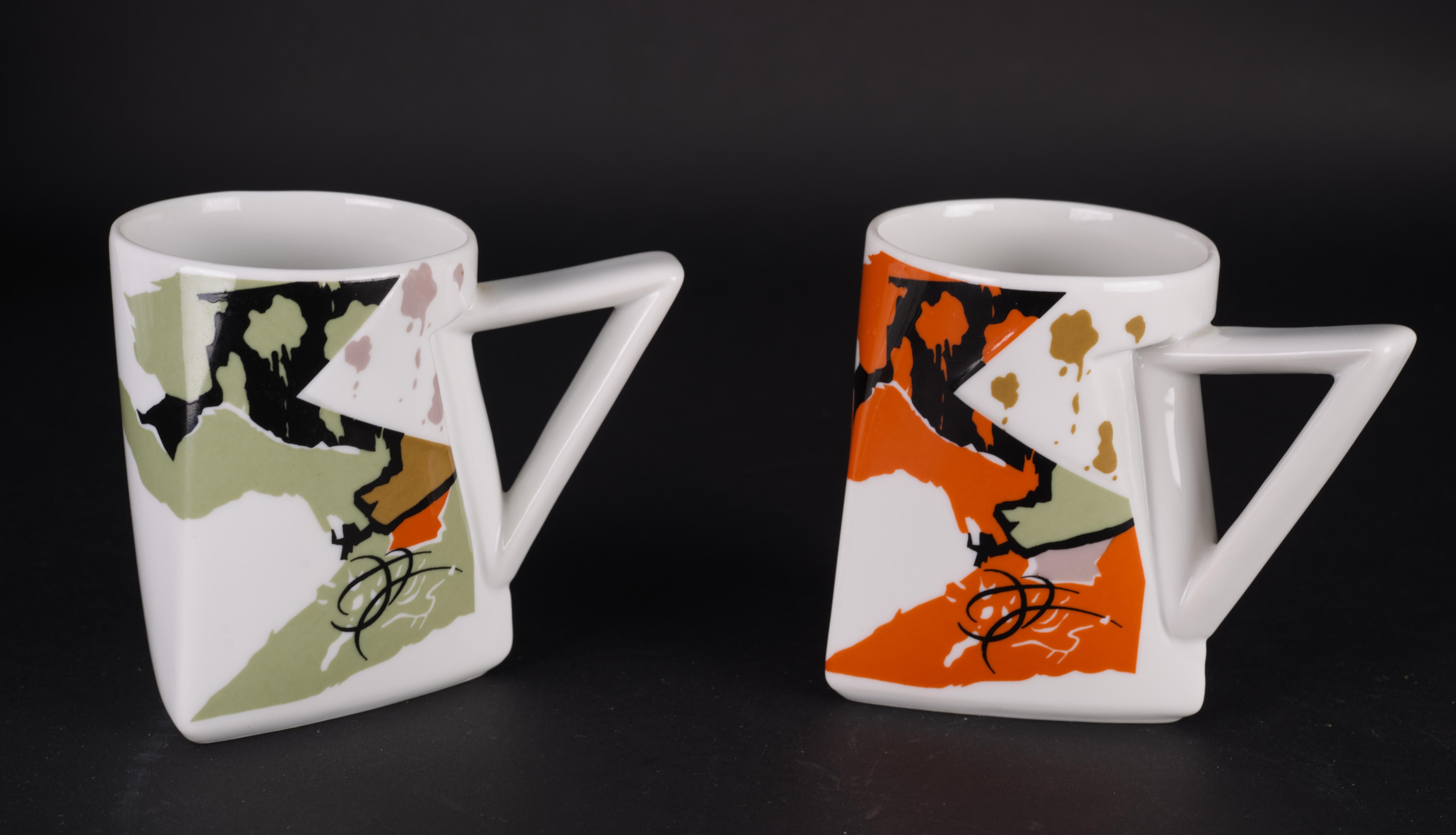 
Pair of mugs in Twilight pattern were designed by Kaneaki Fujimori for Kato Kogei Japan in 1980s. The mugs are decorated with colorful designs in black, olive, and orange that are clearly influenced by Memphis Milano style. Porcelain mugs were made