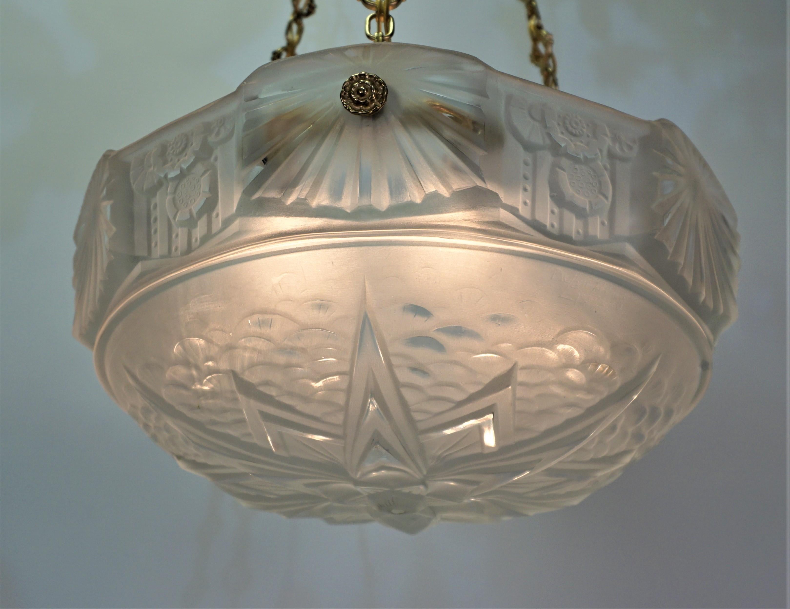 French 1930 Art Deco chandelier with solid bronze hardware, a thick beautiful clear Frost glass with with high light polish.
Total of six lights 60 watts each.
 