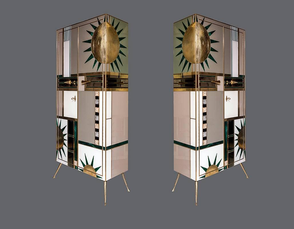 Pair of Italian multicolored opalines glass cabinets, unique pieces, high decorative sculpture cabinets, specular design with brass inlays and opaline glass, shelves inside.