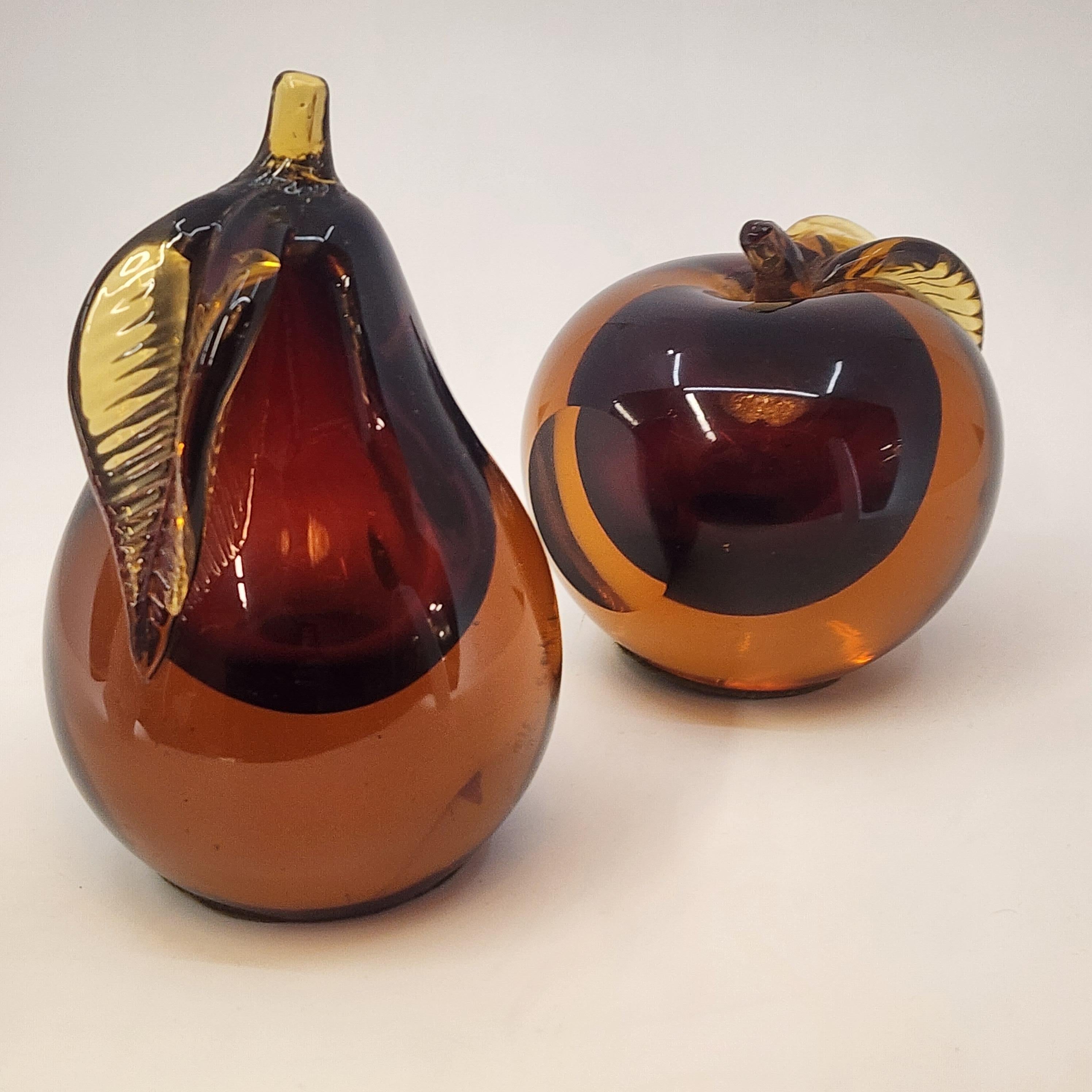 A striking pair of mic century hand blown Murano glass bookends by Barbini.  Cased glass or as the Italians call sommerso (submerged in Italian) is when two layers of glass are put inside of each other.  Beautifully made and has old wool felt on the