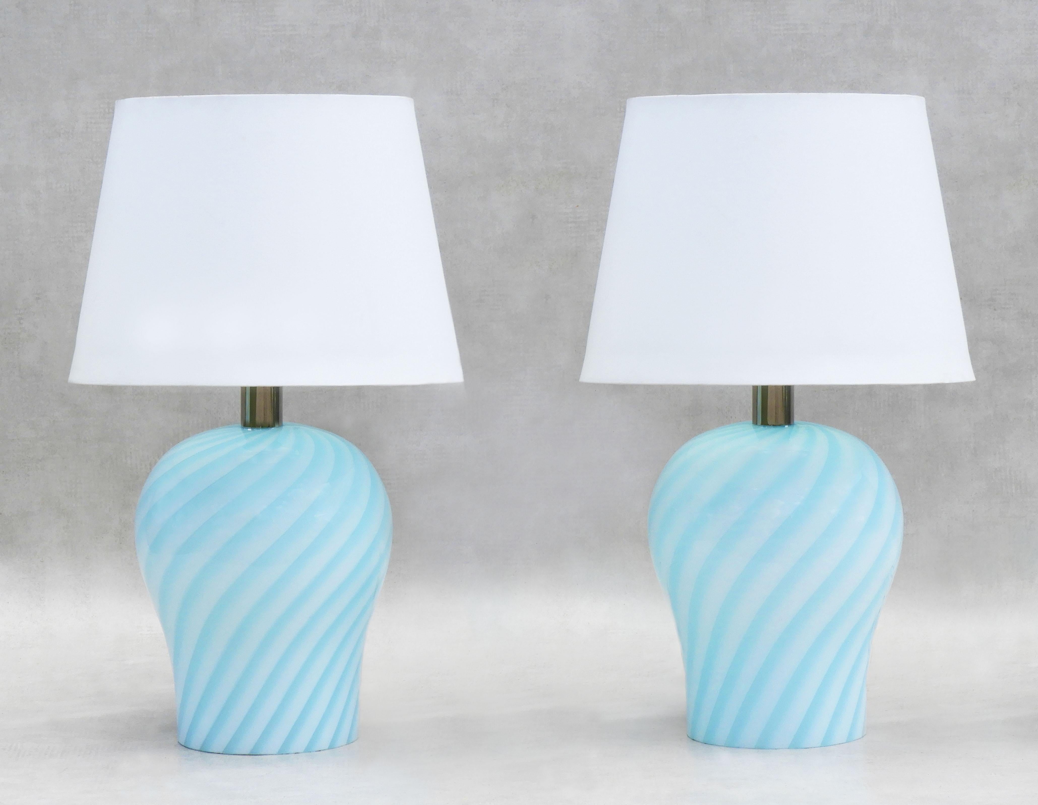 Beautiful pair of Italian hand-blown Murano art glass lamps in glossy pale blue opaque swirl glass circa 1970.  
In very good condition, with no losses to glass.  Completely rewired with all new electrical components and suitable for use