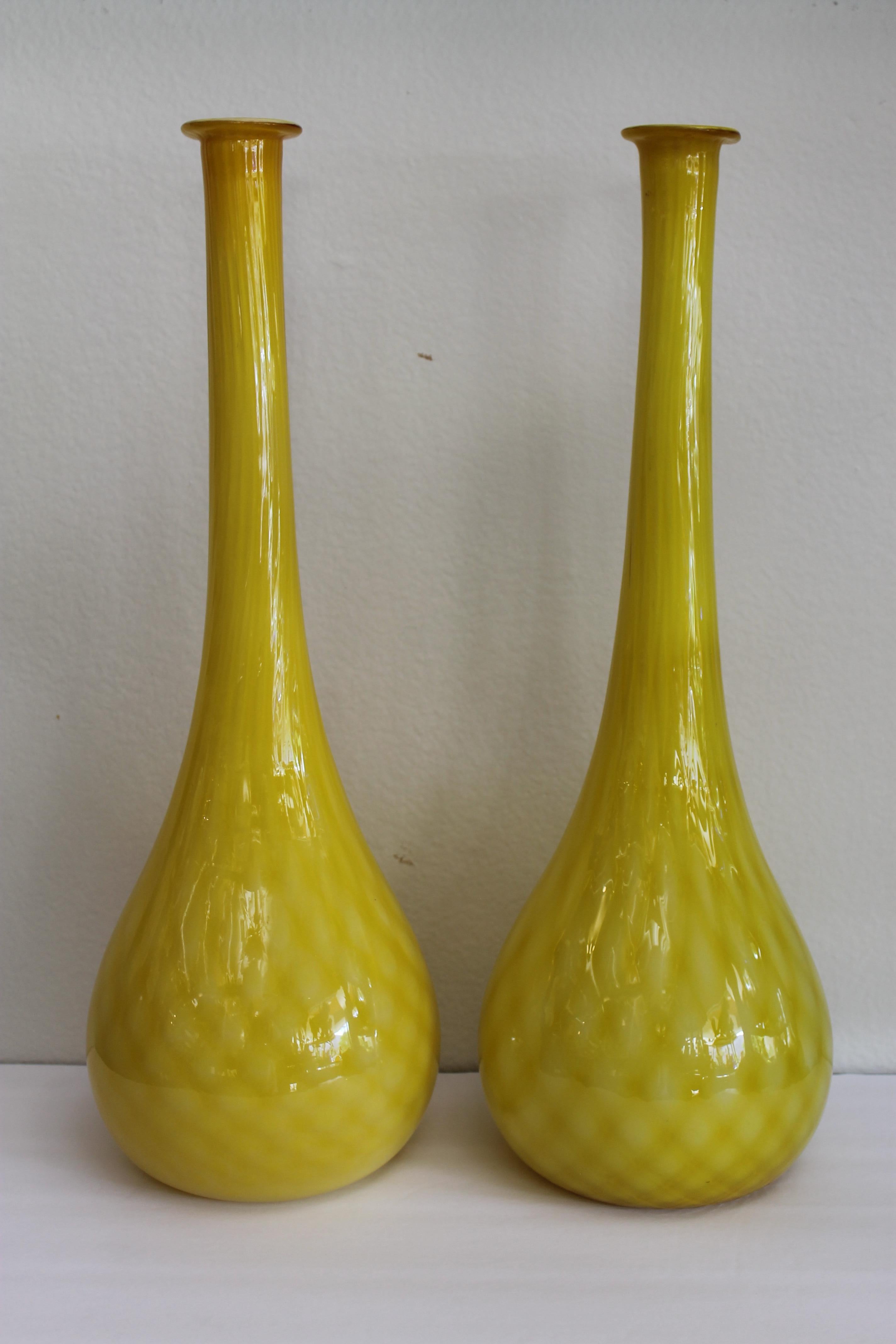 Pair of Murano cased glass yellow vases with a diamond pattern. Vases measure about 20
