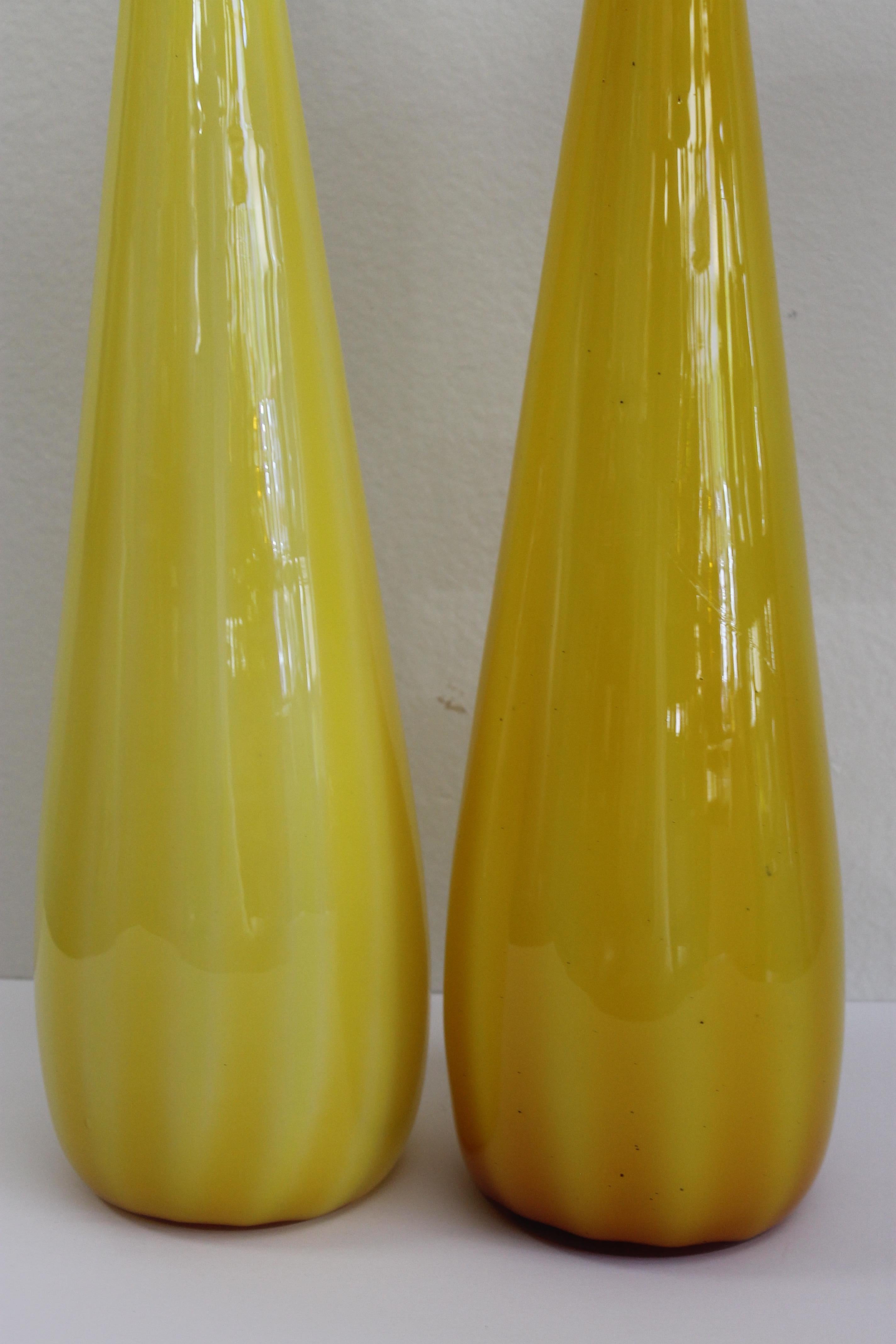 Pair of yellow italian cased glass vases with vertical stripes. Each measure about 20.5