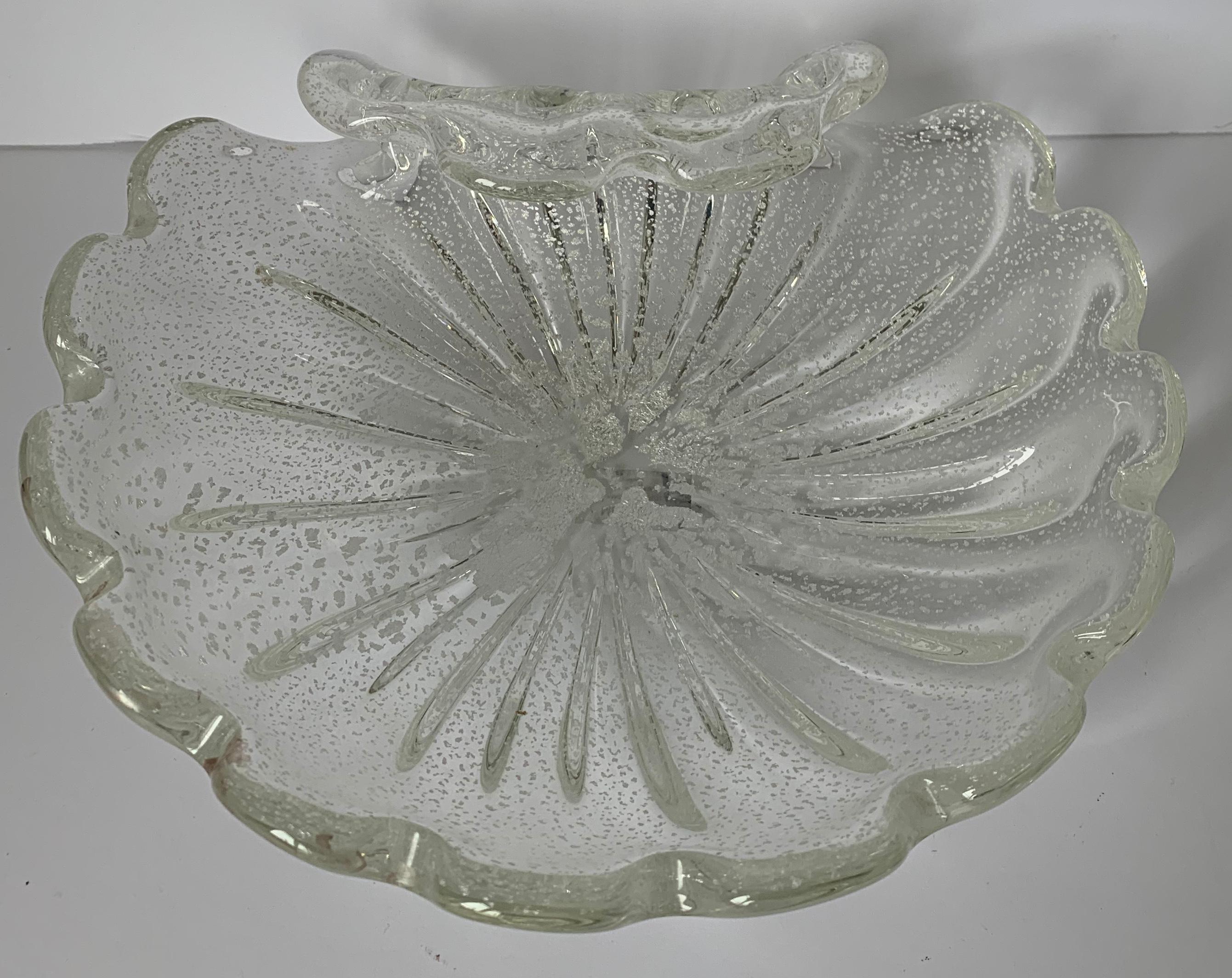 Pair of large Murano clamshell bowls or ashtrays. Clear ribbed glass with all-over silver flecking. No makers mark.