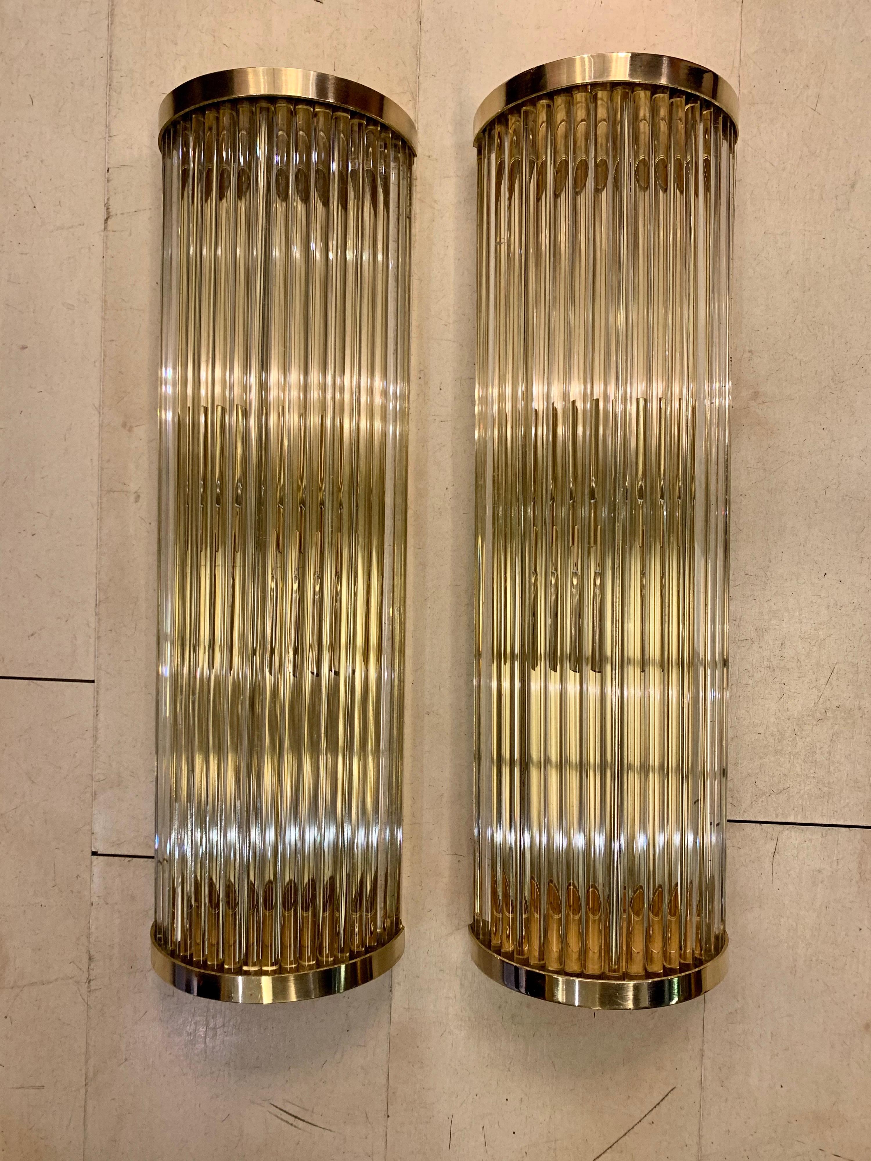 Pair of Murano clear glass wall sconces, round structure with hand blown transparent glass elements that are multiplying the light effect, brass structure. They can be positioned both horizontally and vertically, two bulbs per sconces, new