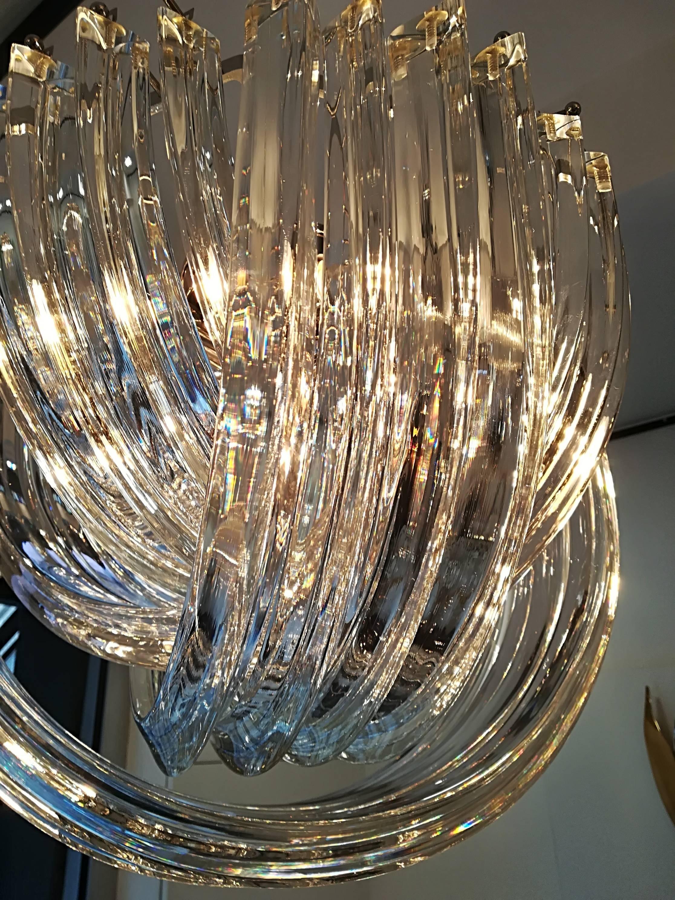 Murano hand blown clear crystal glass chandelier.
(Two pieces) 
Fixture in plated chrome.
Measures: Diameter 40 cm
Four bulbs
Measure: Height (38 cm) is only for the basket.
Total H 110cm can be reduced or increased.
Can be sold separately.