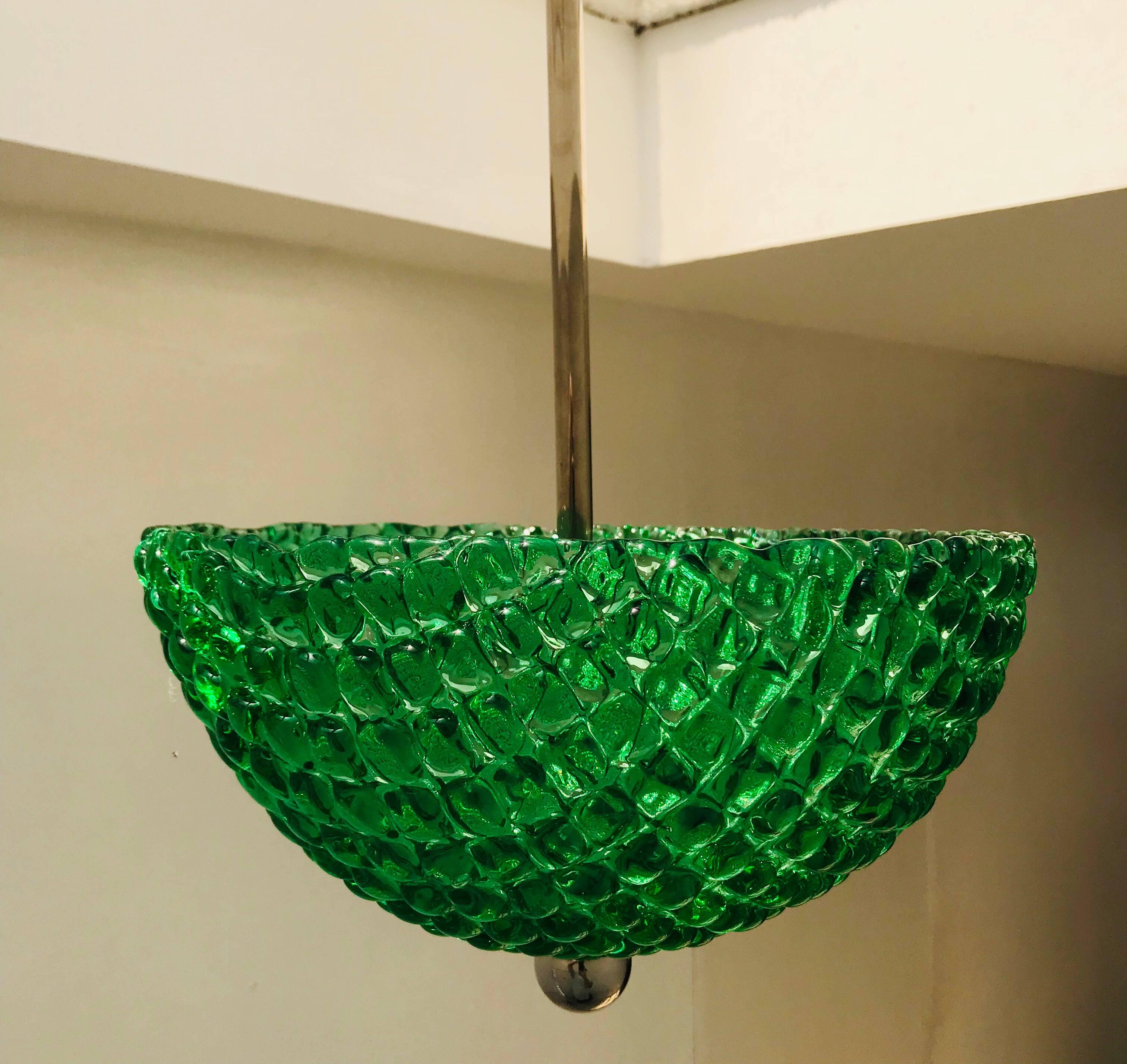 A wonderful pair of bright emerald green lattice design Murano glass bowls with polished nickel hardware. Three lights sources in each pendant. Newly rewired.