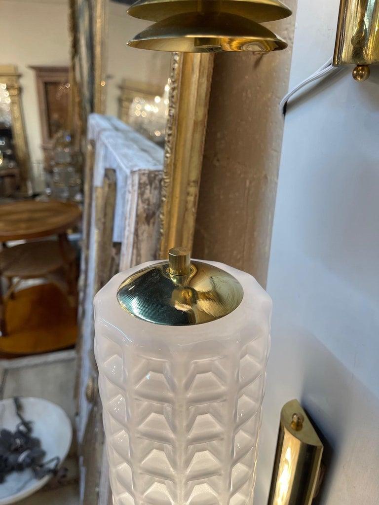 Decorative pair of Murano glass and brass barber style sconces. Beautiful textured pattern on the glass on a pretty brass base. Very fine quality!!
