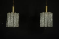 Pair of murano glass and brass chandeliers in the style of Toni Zuccheri. Italy