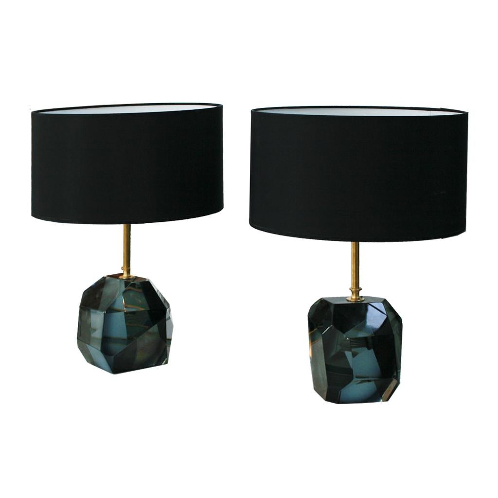 Pair of lamps made with translucent faceted green Murano glass original from the 1970s, brass structure and black chintz lampshades, Italy, 1970s.