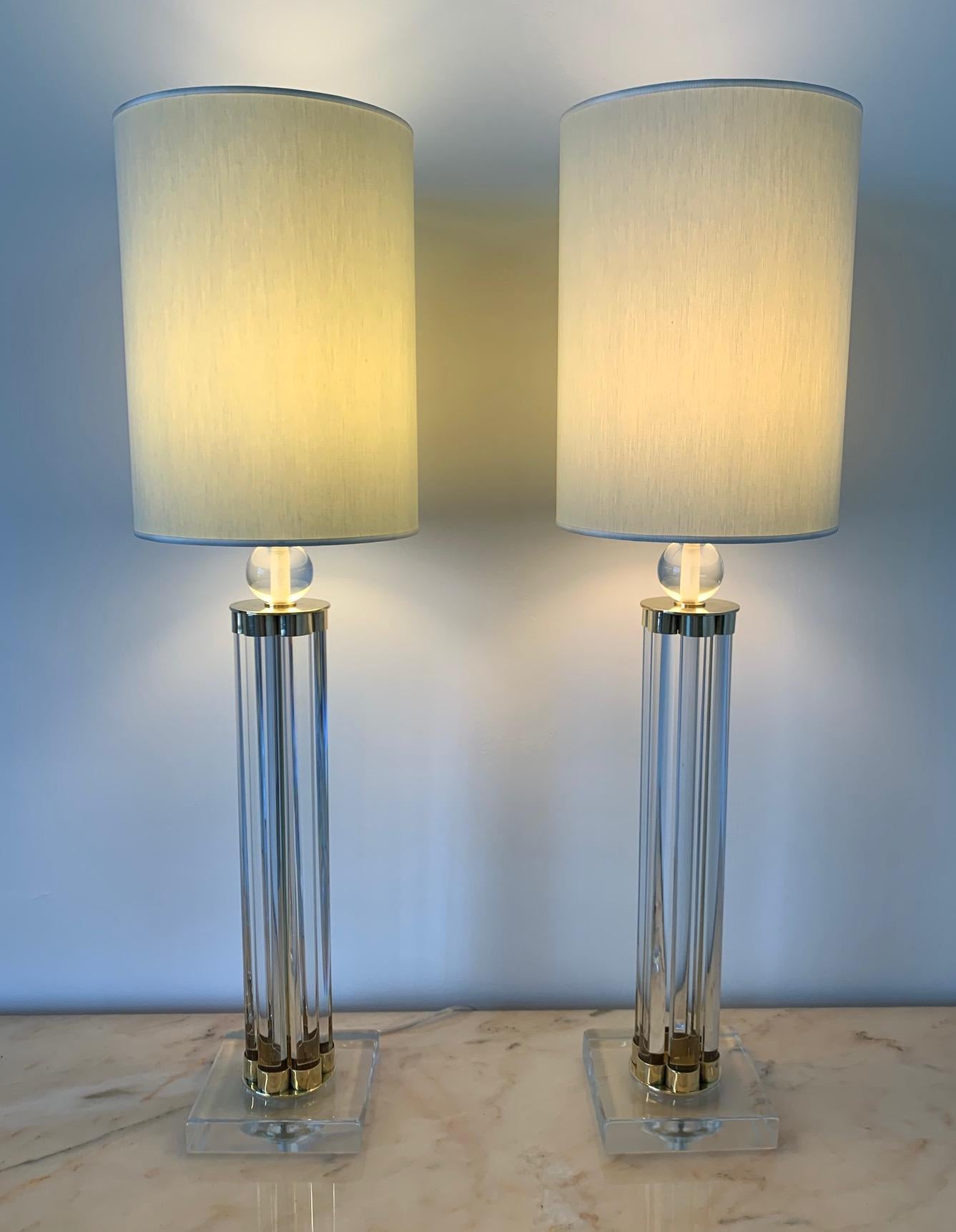 This pair of Murano lamps was produced in Italy in the early 2000s.
The lamps are completely in Murano glass and brass details.