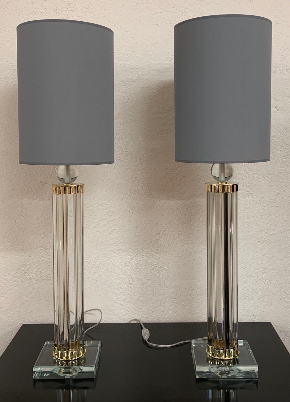 This pair of Murano lamps was produced in Italy in the early 2000s.
The lamps are completely in Murano glass and brass details.