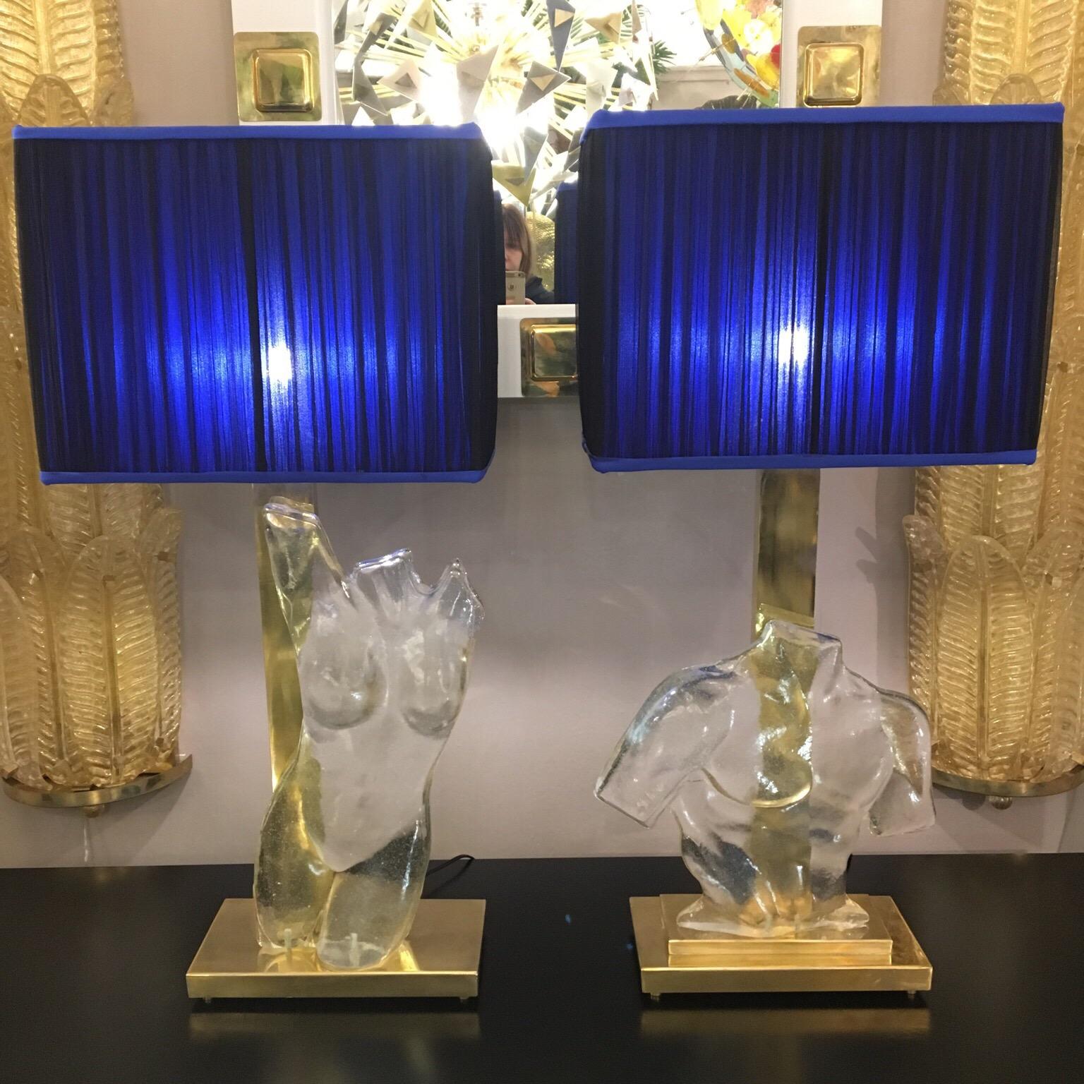 Pair of Murano clear glass sculpture representing masculine and feminine bust. Brass rectangular base and structure. Handmade rectangular lampshades, double color silk chiffon (royal blue inside and blue black outside). Measurements without the