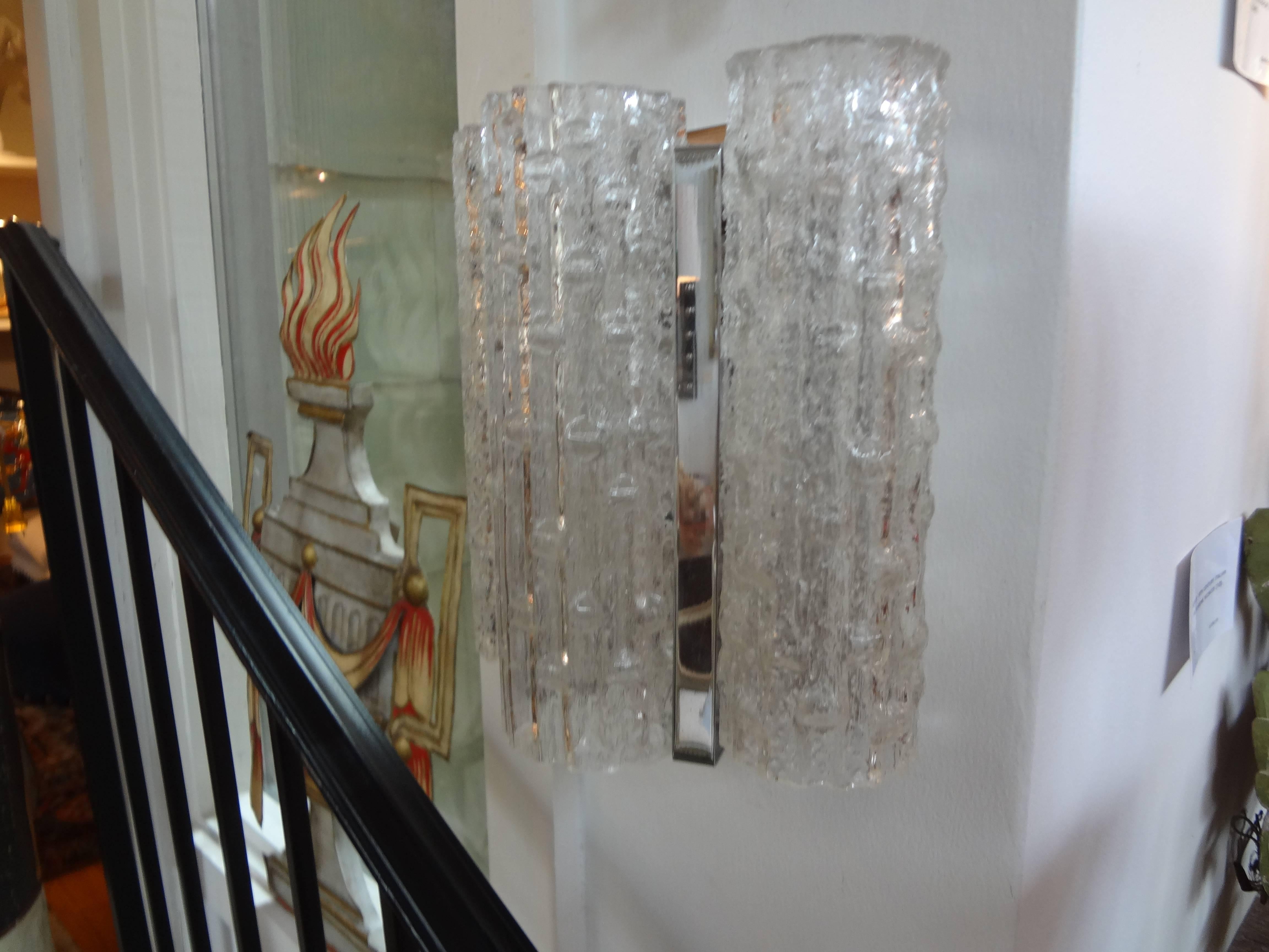 Pair of Venini style Murano glass sconces.
Pair of Italian Mid-Century Modern Venini style Murano glass sconces with chrome bases. These Murano sconces or Venetian glass sconces have been newly wired for the U.S. market.