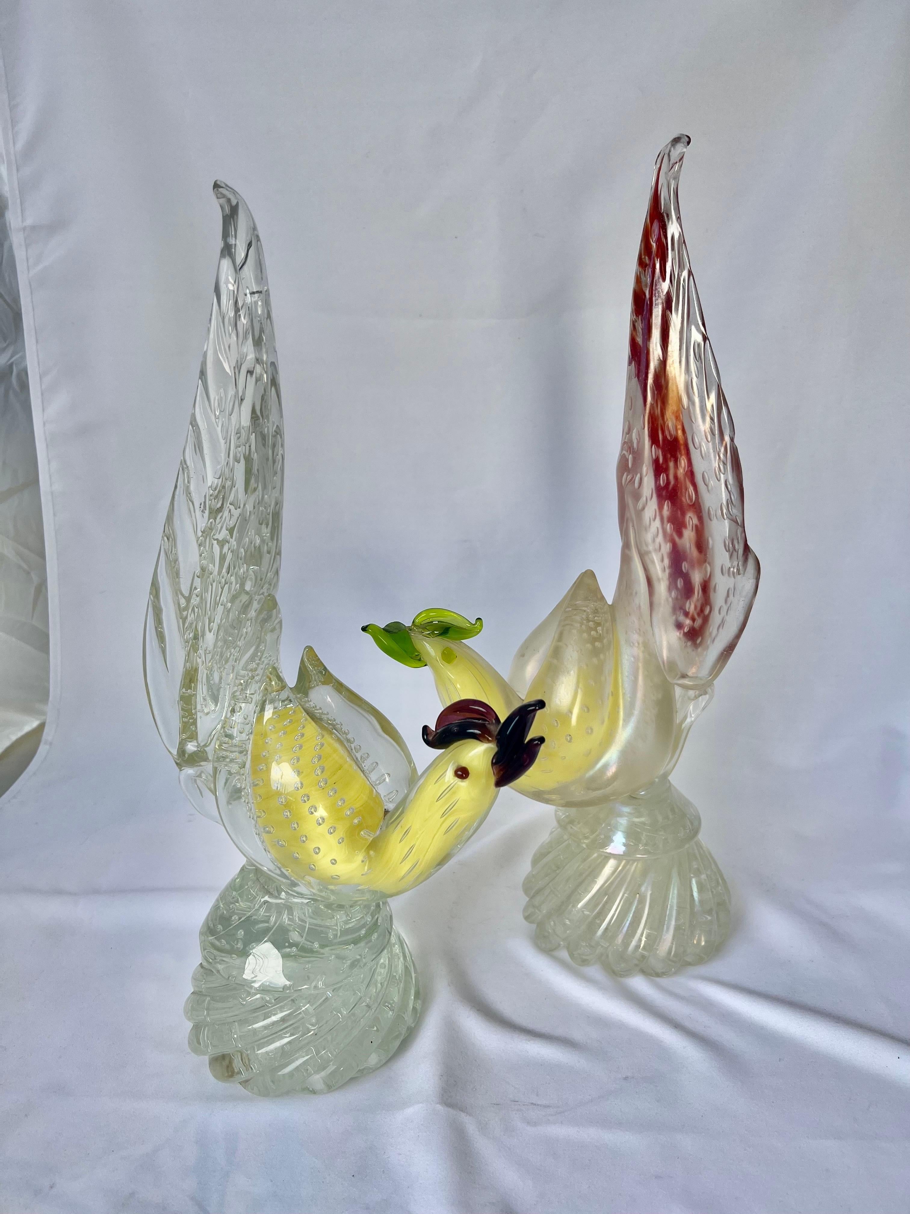 Pair of Italian Murano glass hand crafted pair of detailed birds with long feathery tails. They were all hand blown in Venice, Italy.