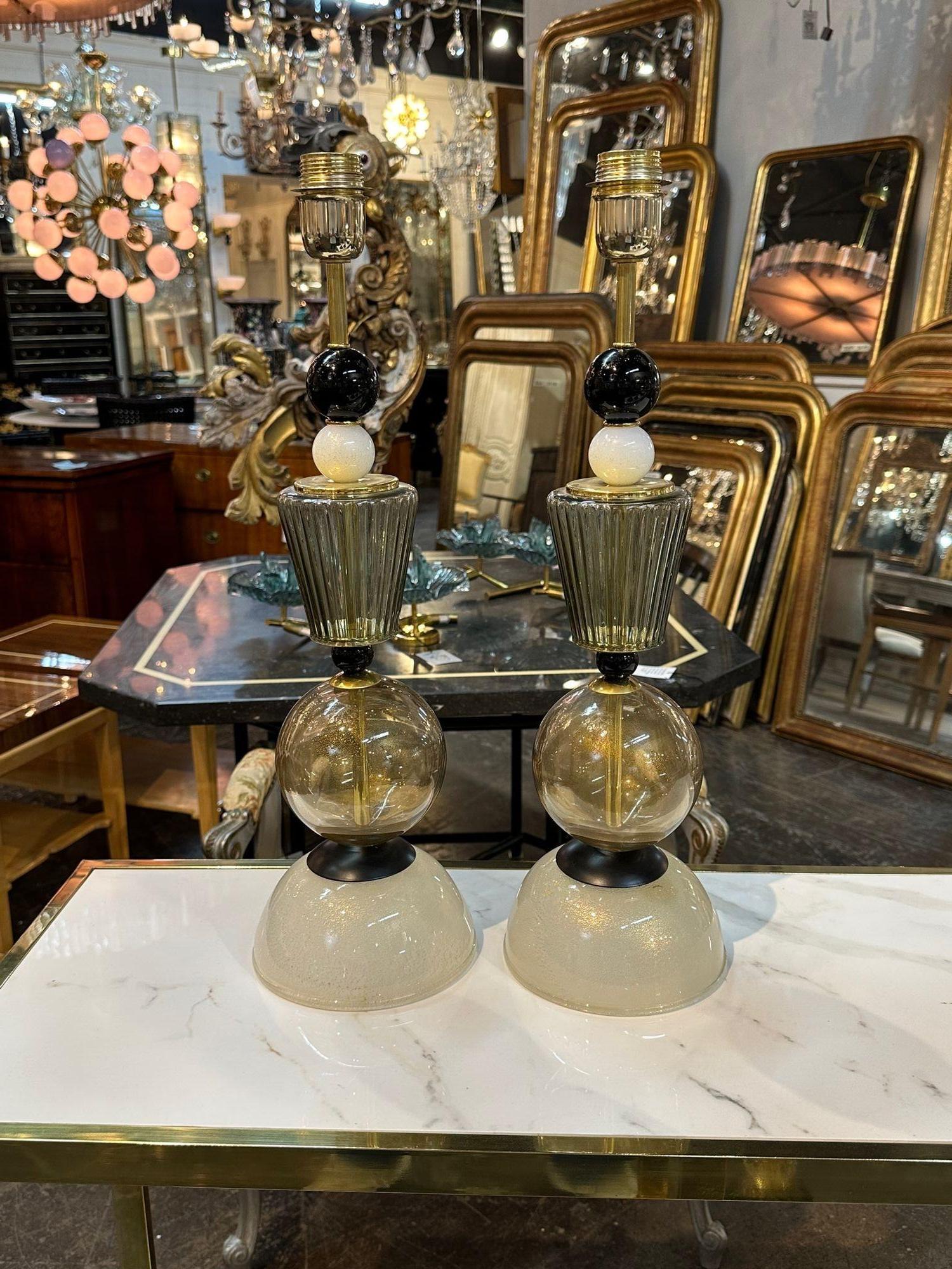 Pair of modern Murano glass black and gold component lamps. circa 2000. Perfect for today's transitional designs!