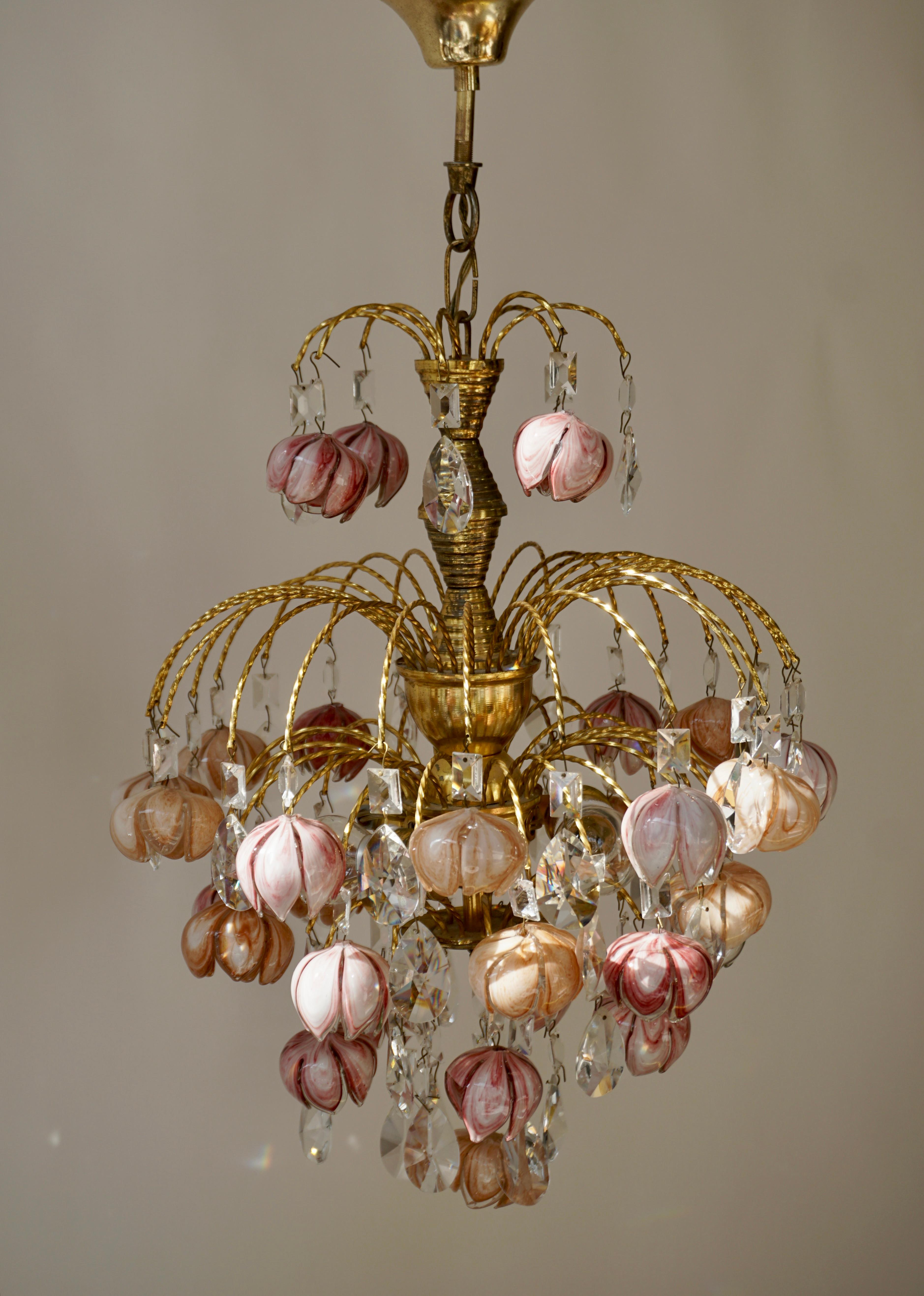 Two very beautiful and rare floral chandeliers in Murano glass designated and produced in Italy in the 1970s. Golden metal chandelier composed of pink and white flower-shaped glasses. Rare design object that will illuminate your interior