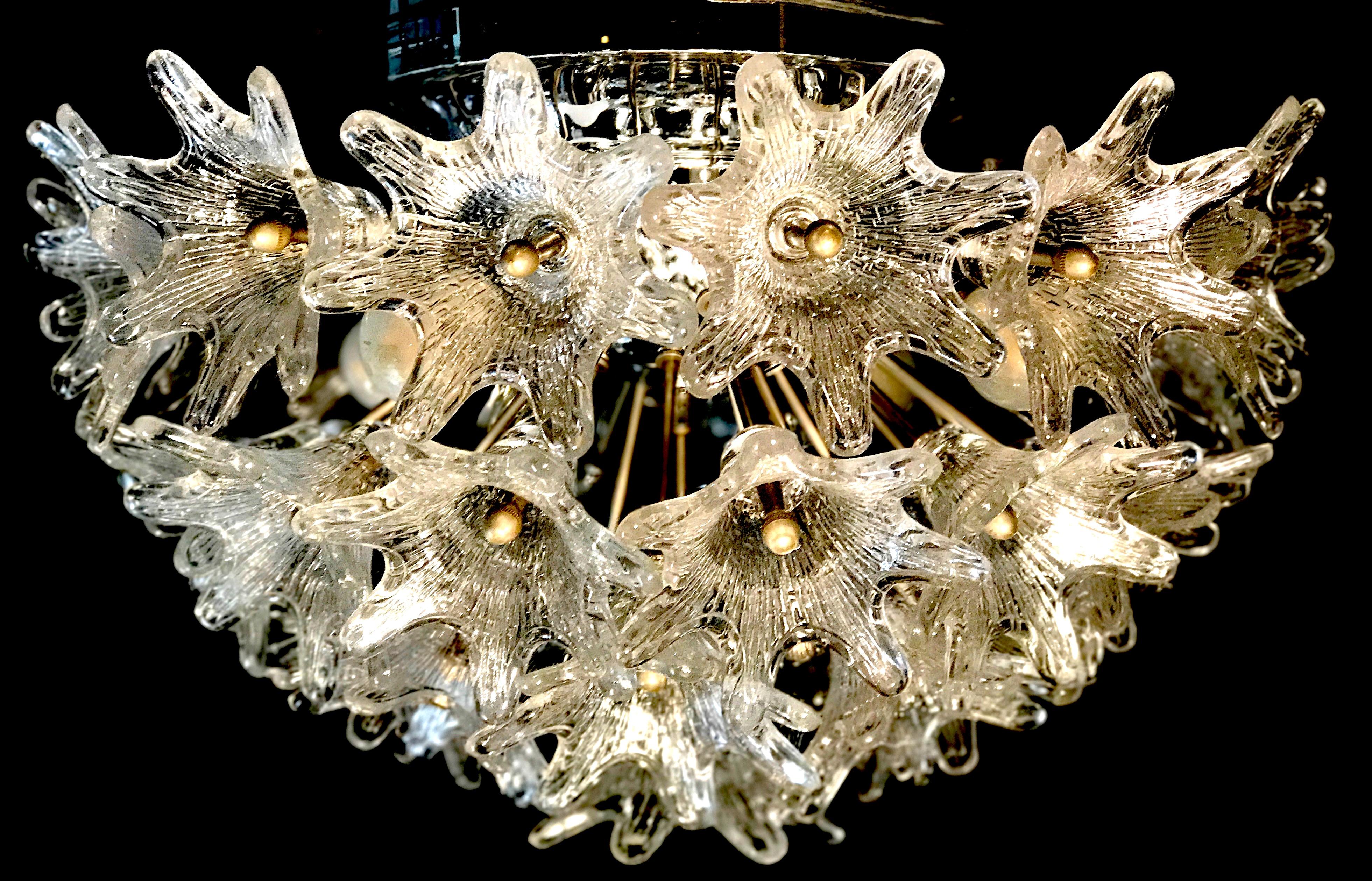 Flush mount Murano glass chandelier by Paolo Venini for VeArt, Italy with 32 clear glass flowers on a chrome sputnik frame. Amazing eye catching piece designed in the 1960s, Italy. The lamp takes four small Edison base bulbs.
