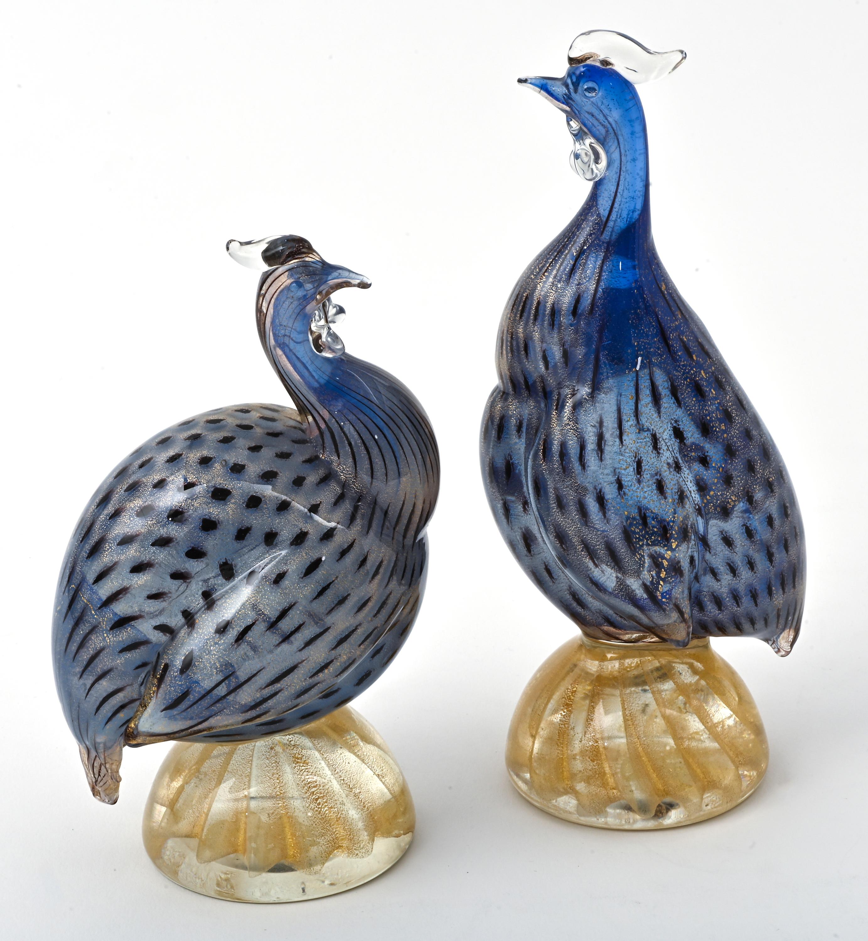 Beautiful pair of Italian Murano glass guinea hen birds. Beautiful coloration in blue and gold flecks infused into the glass. Very good condition.