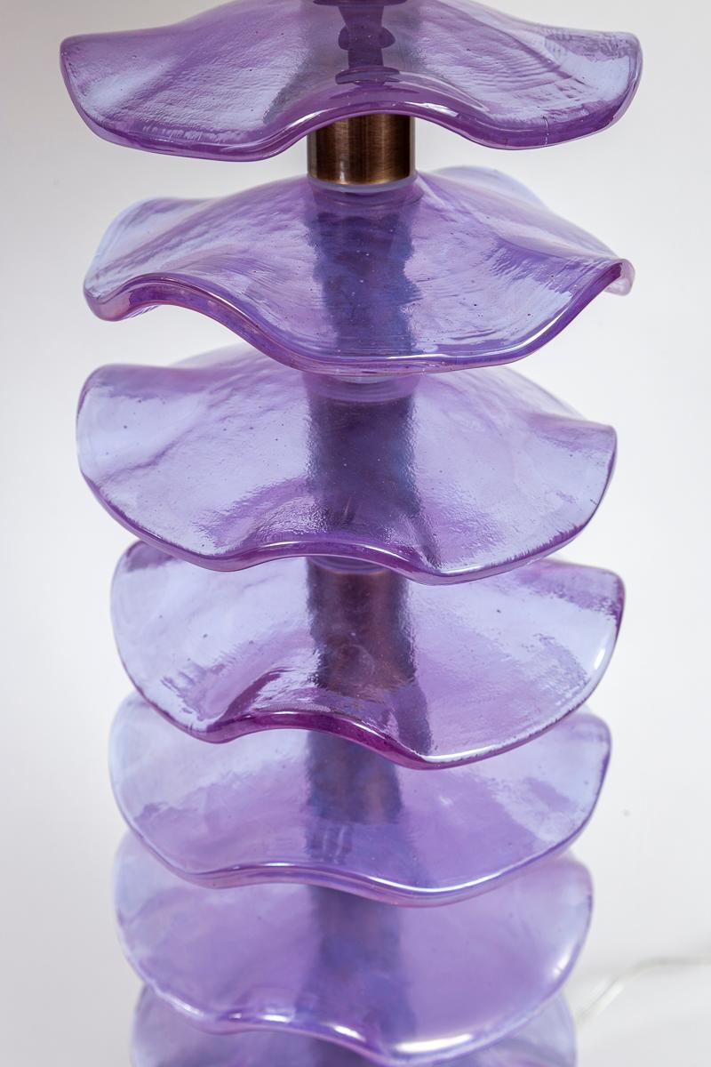 A lovely pair of eight thickly blown iridescent lavender wavy glass disks elegantly  displayed on a bronze finish  on brass frame and base creating an organic modern effect.

Electrified to code for 1 medium base bulb with an  on/off cord switch at