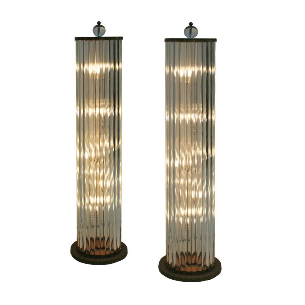 Pair of lamps made with white metallic structure, Murano glass pieces and brass details.